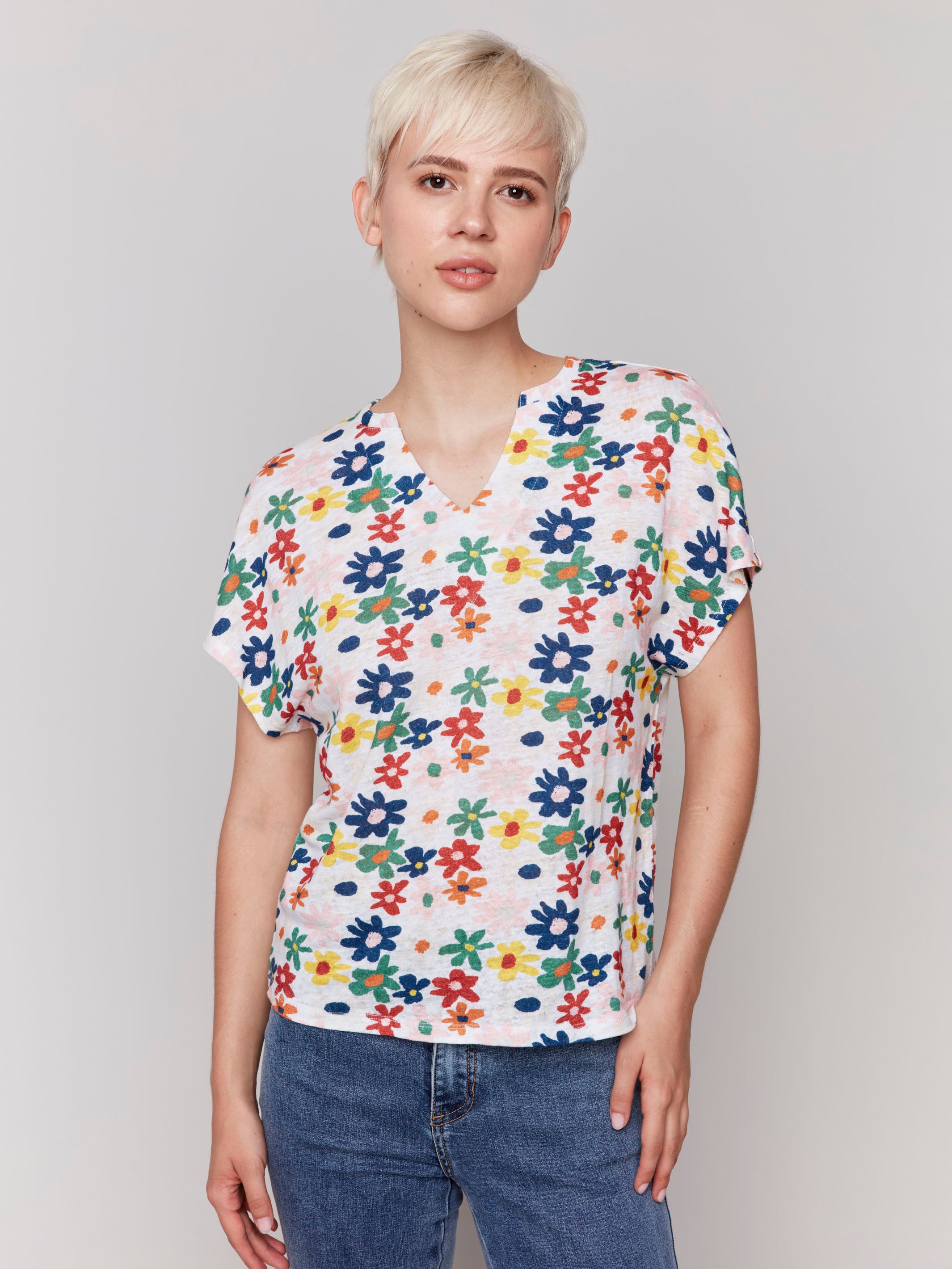 Top featuring a split neck and daisy print, crafted in a lightweight fabric by Charlie B.