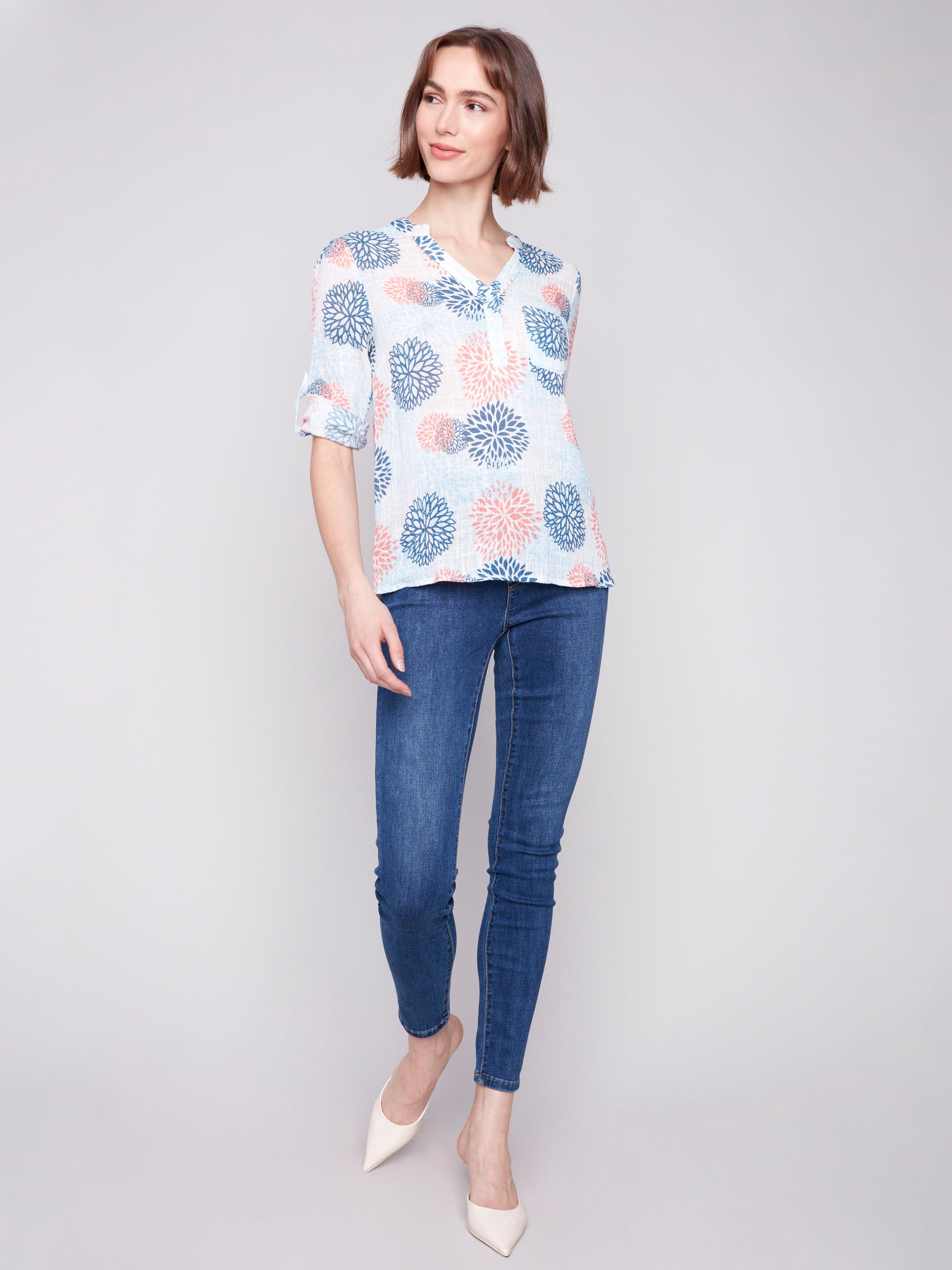 Floral pattern in jasmine tones on a soft cotton blouse by Charlie B.