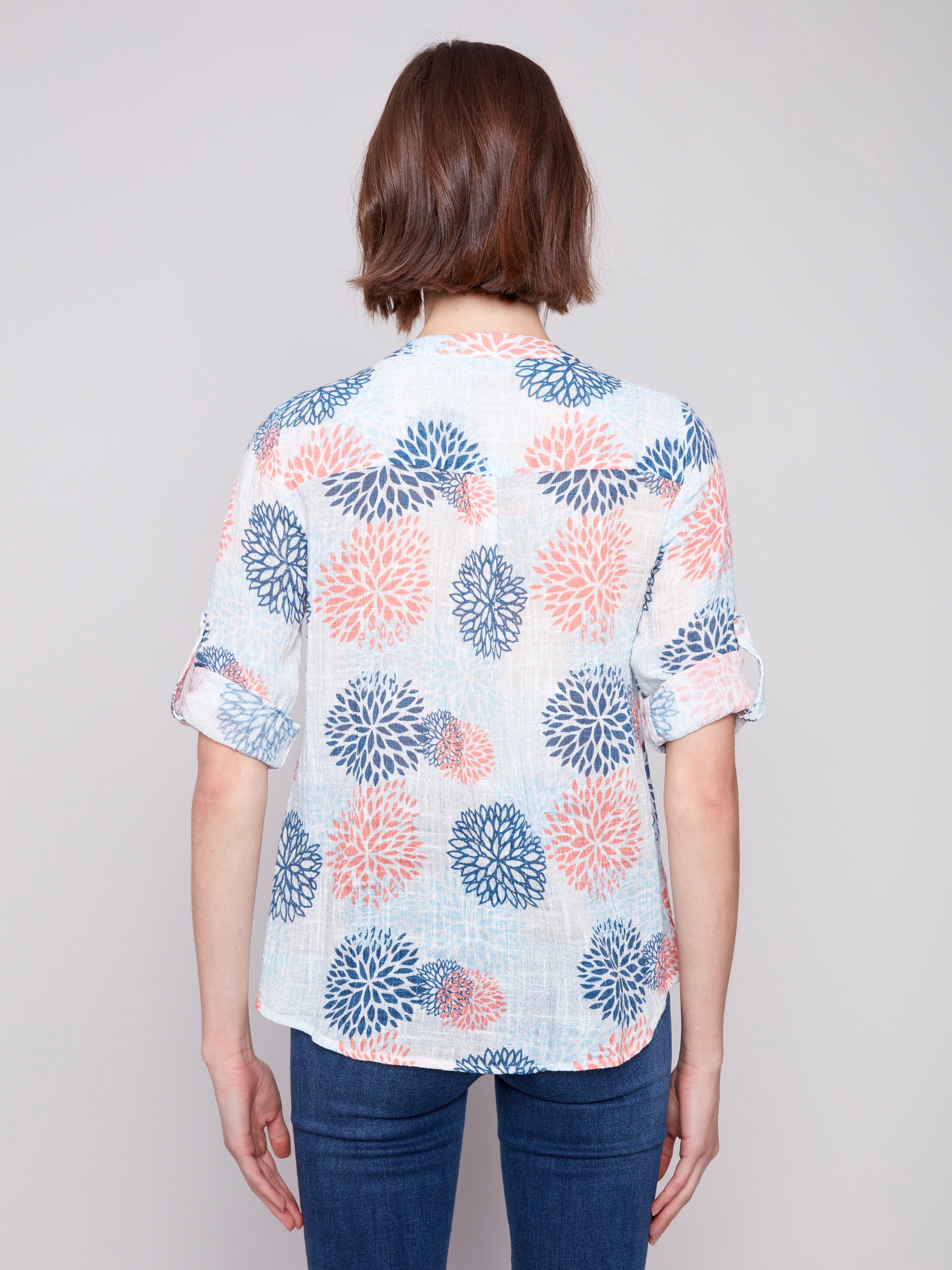 Half-button front adds charm to this floral jasmine blouse by Charlie B.