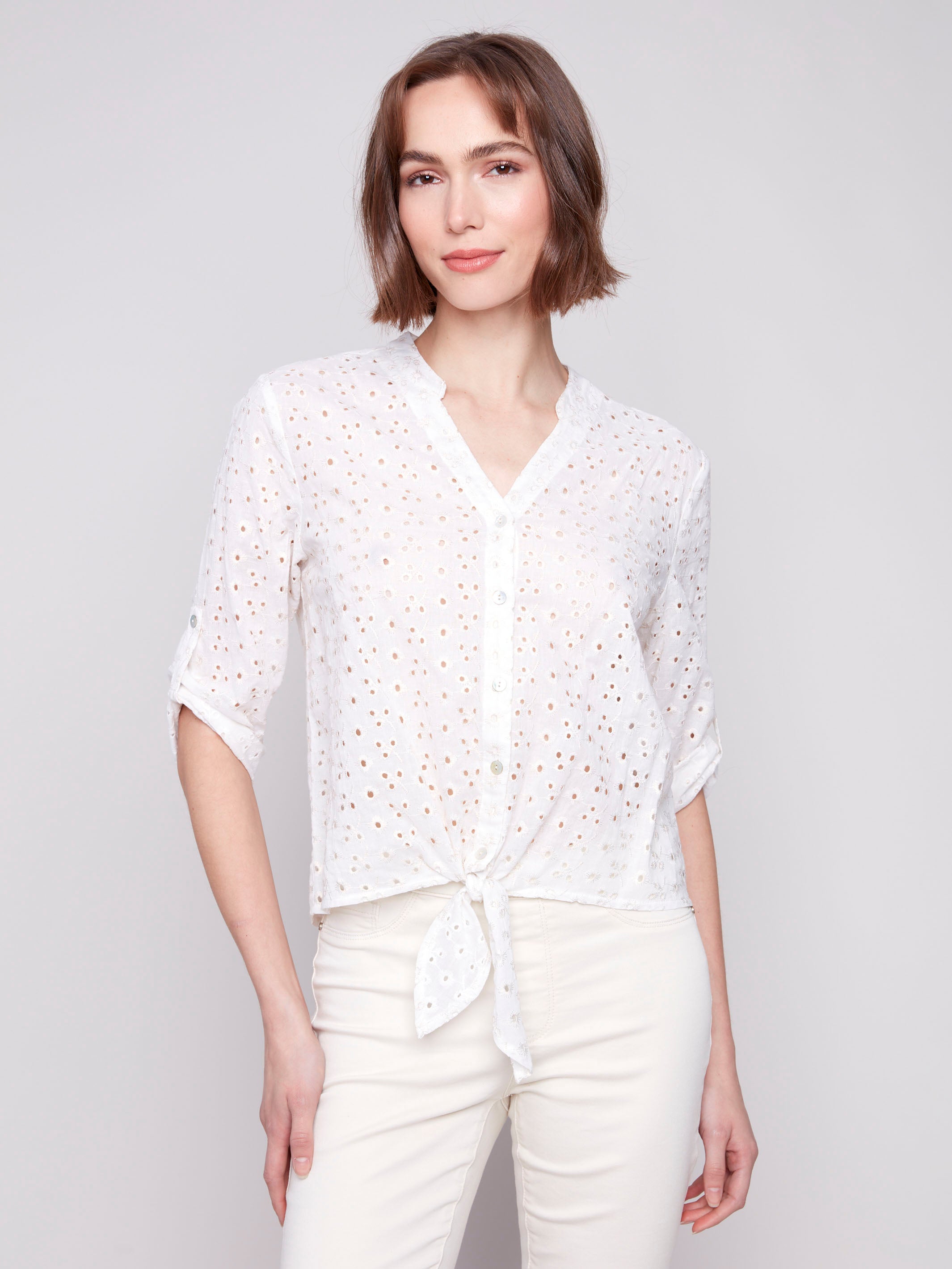 White blouse with button-down front, featuring eyelet fabric by Charlie B.