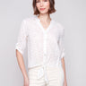 White blouse with button-down front, featuring eyelet fabric by Charlie B.