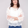 Natural crochet top with boatneck, showcasing stylish design by Charlie B.