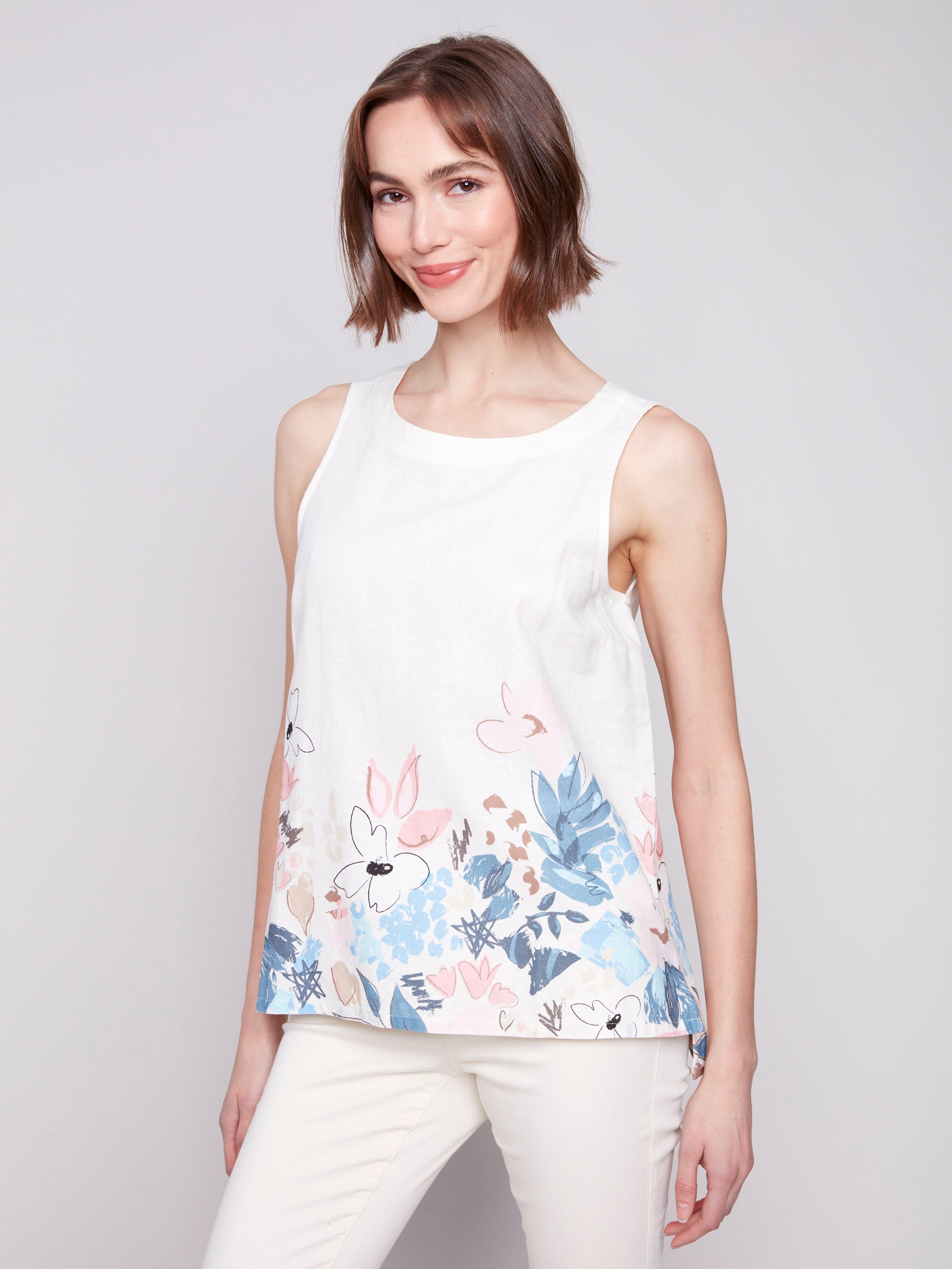 Linen blend top with crew neckline and a floral border by Charlie B.