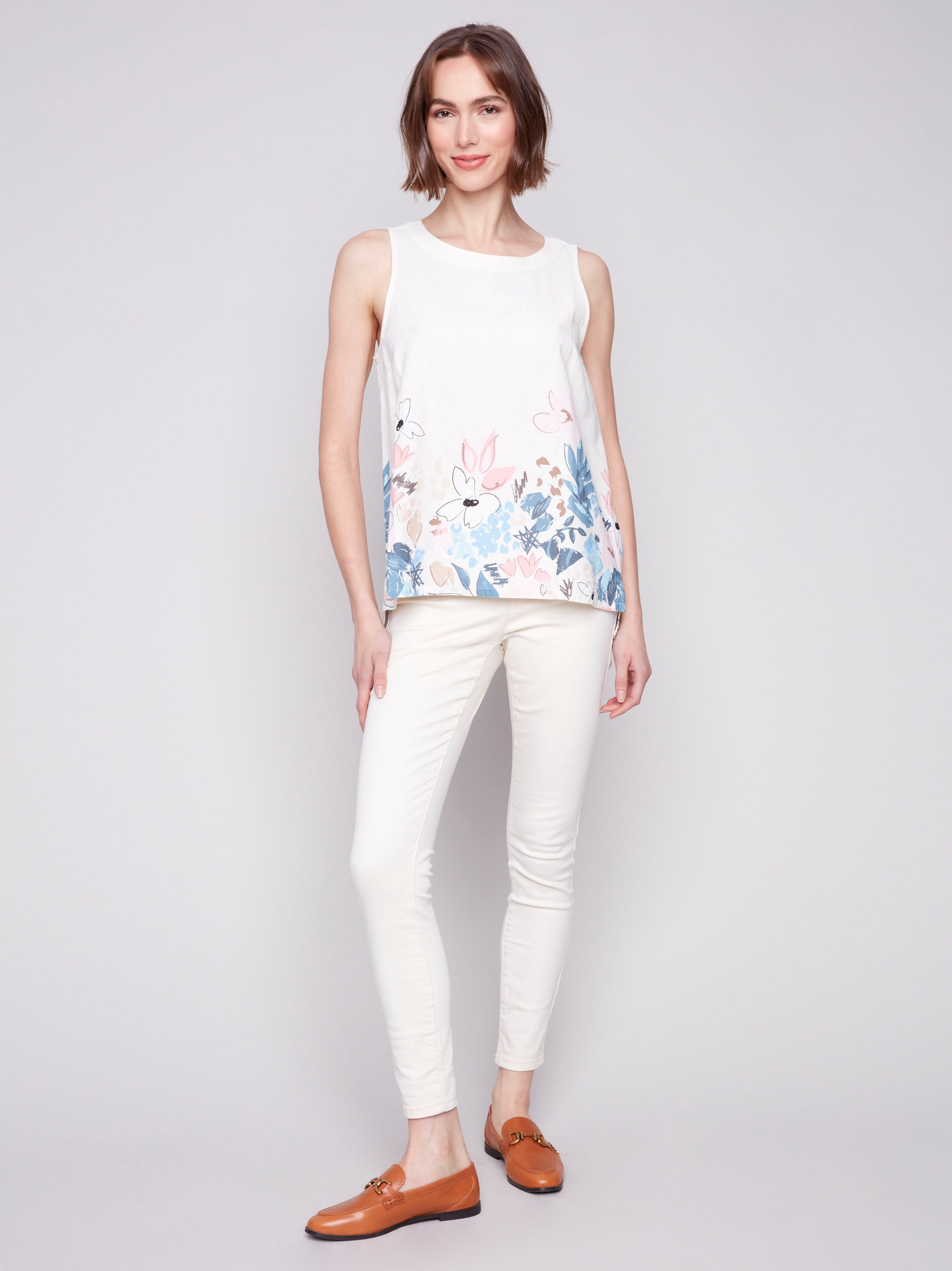 Floral print sleeveless top featuring a high-low hem by Charlie B.