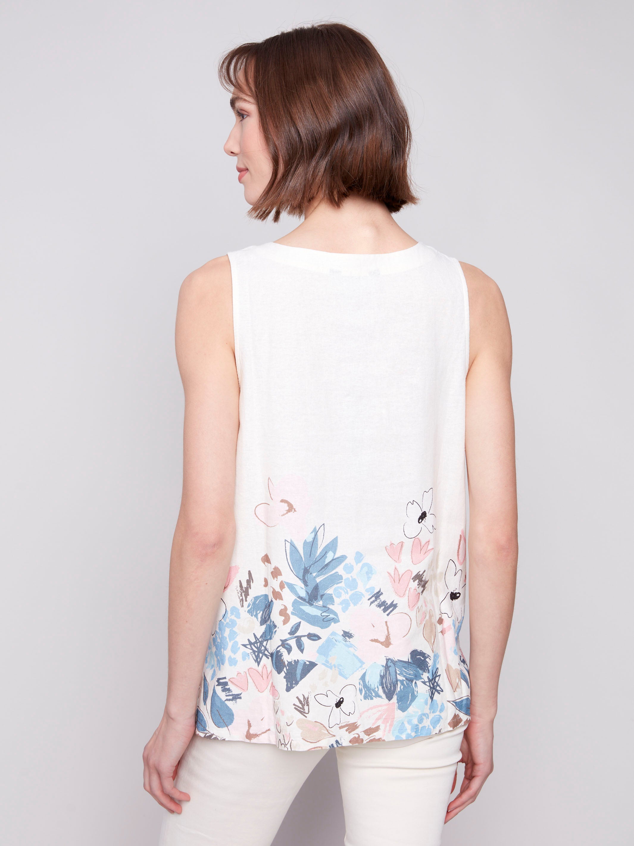 Stylish high-low hem top with a crew neckline and floral design by Charlie B.