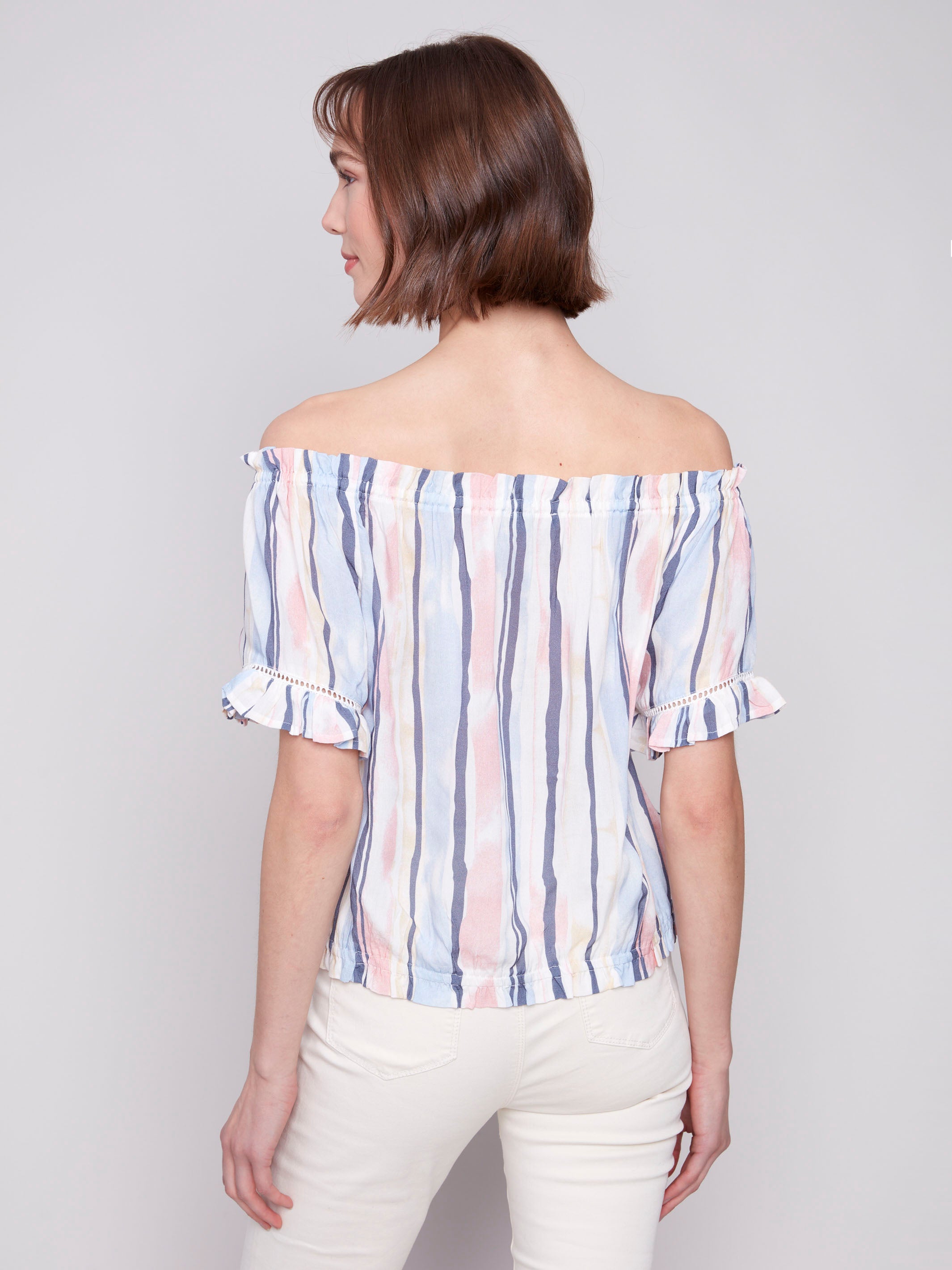 Elasticated neckline blouse in colorful pattern by Charlie B.