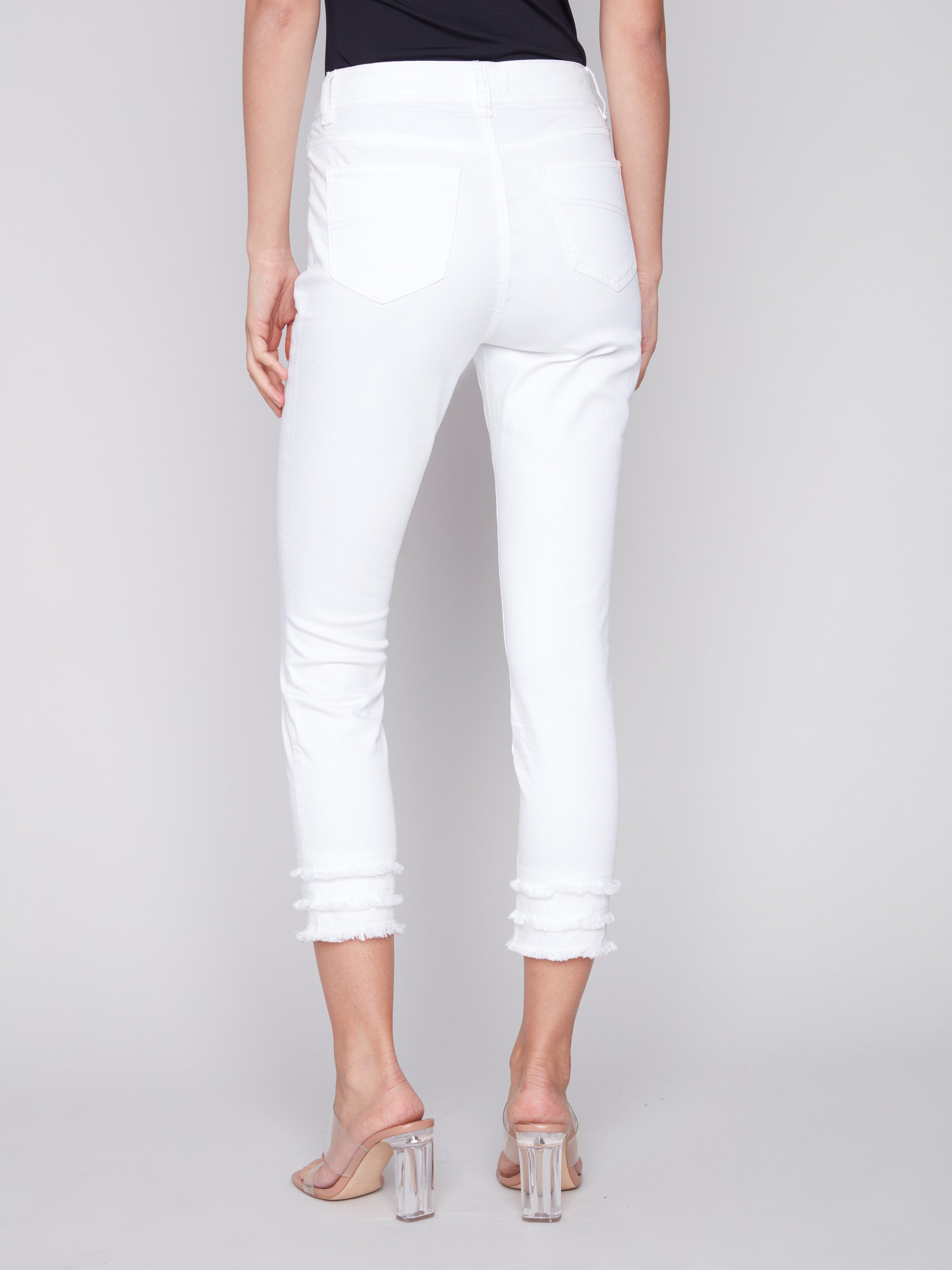 Skinny fit white pants with a stylish frayed hem, perfect for any casual occasion by Charlie B.