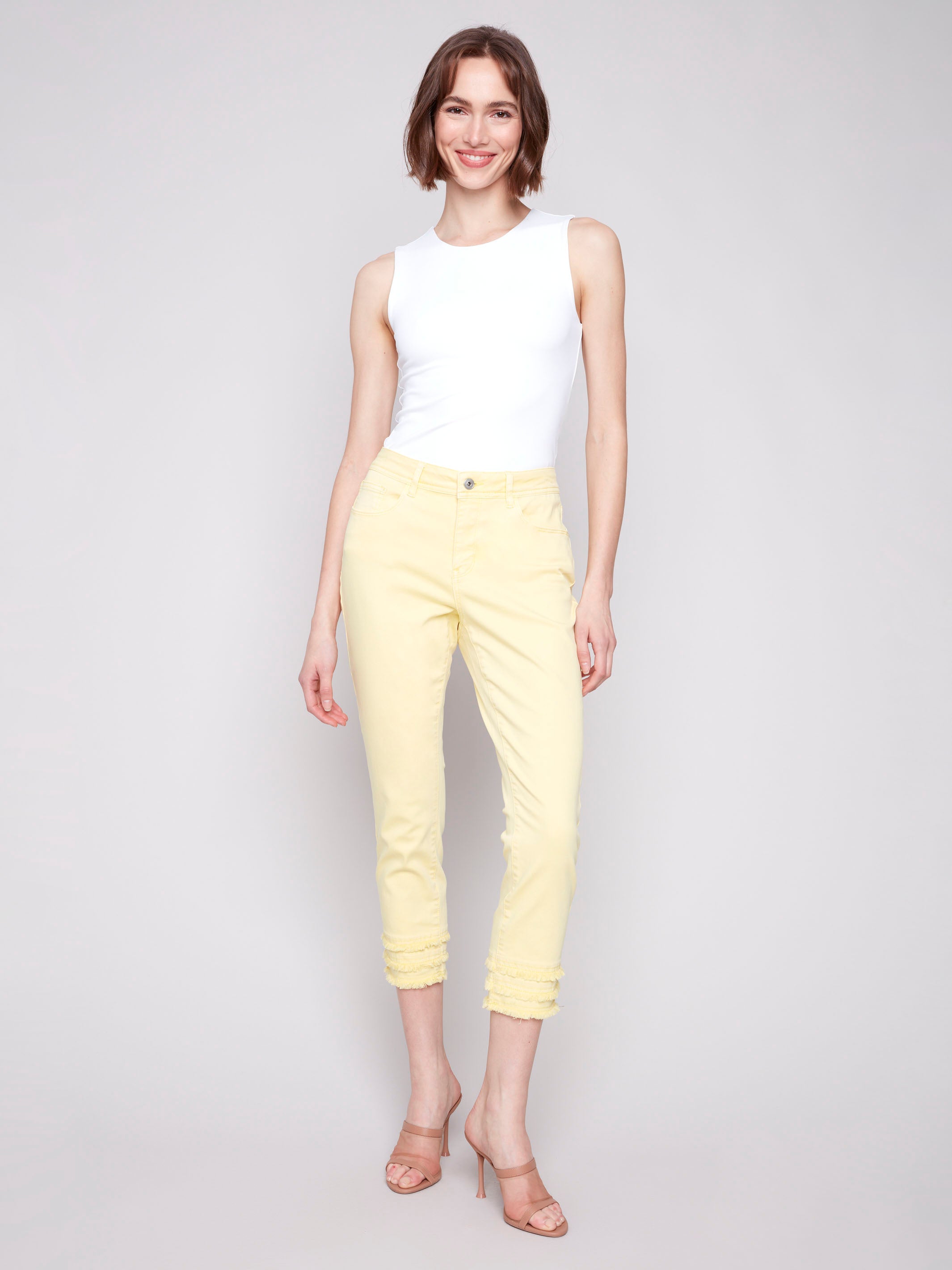 Yellow cropped pants with a regular rise waist and stretch twill fabric by Charlie B.