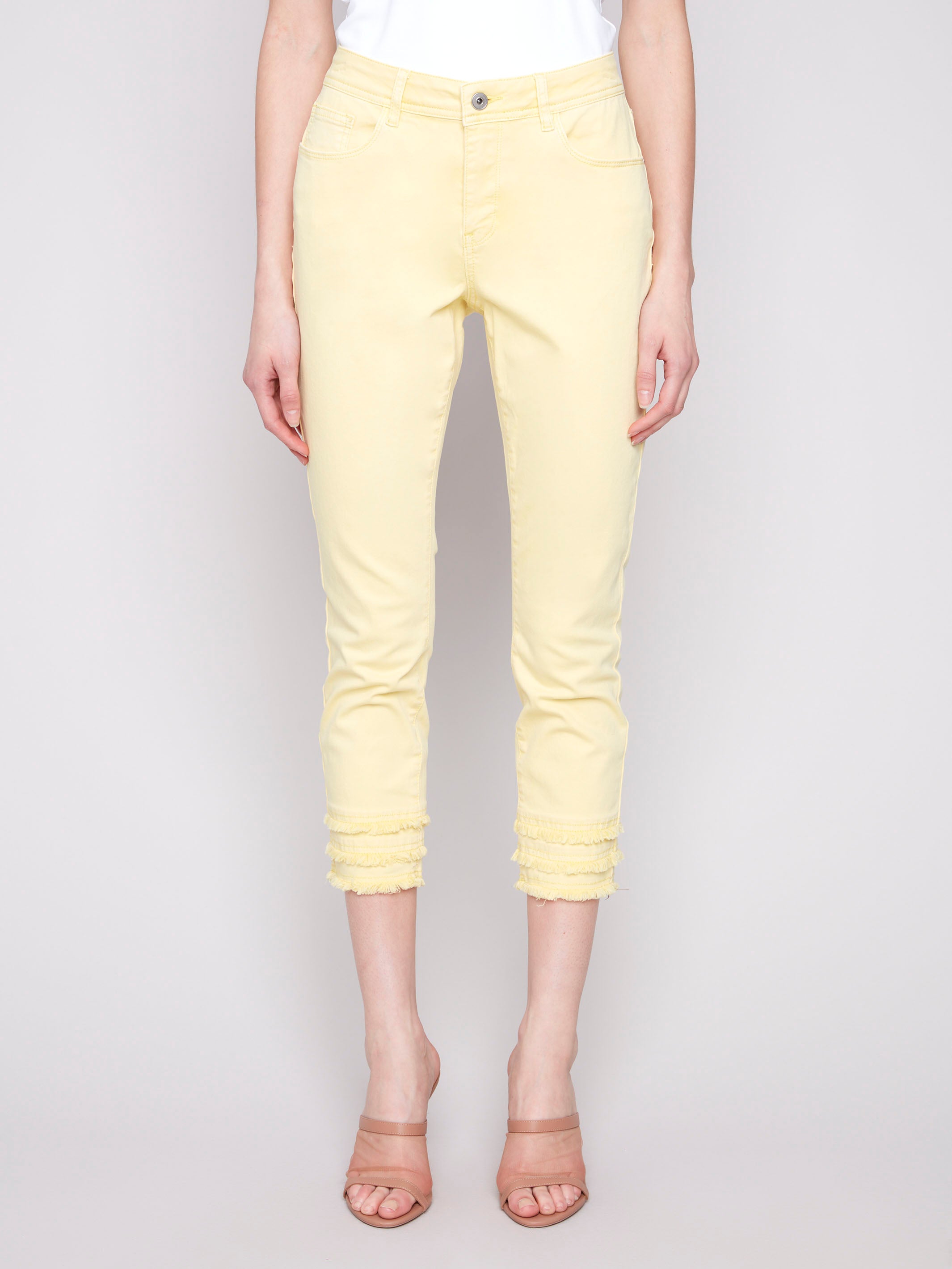 Cropped yellow twill pants featuring a five-pocket design for versatile styling by Charlie B.