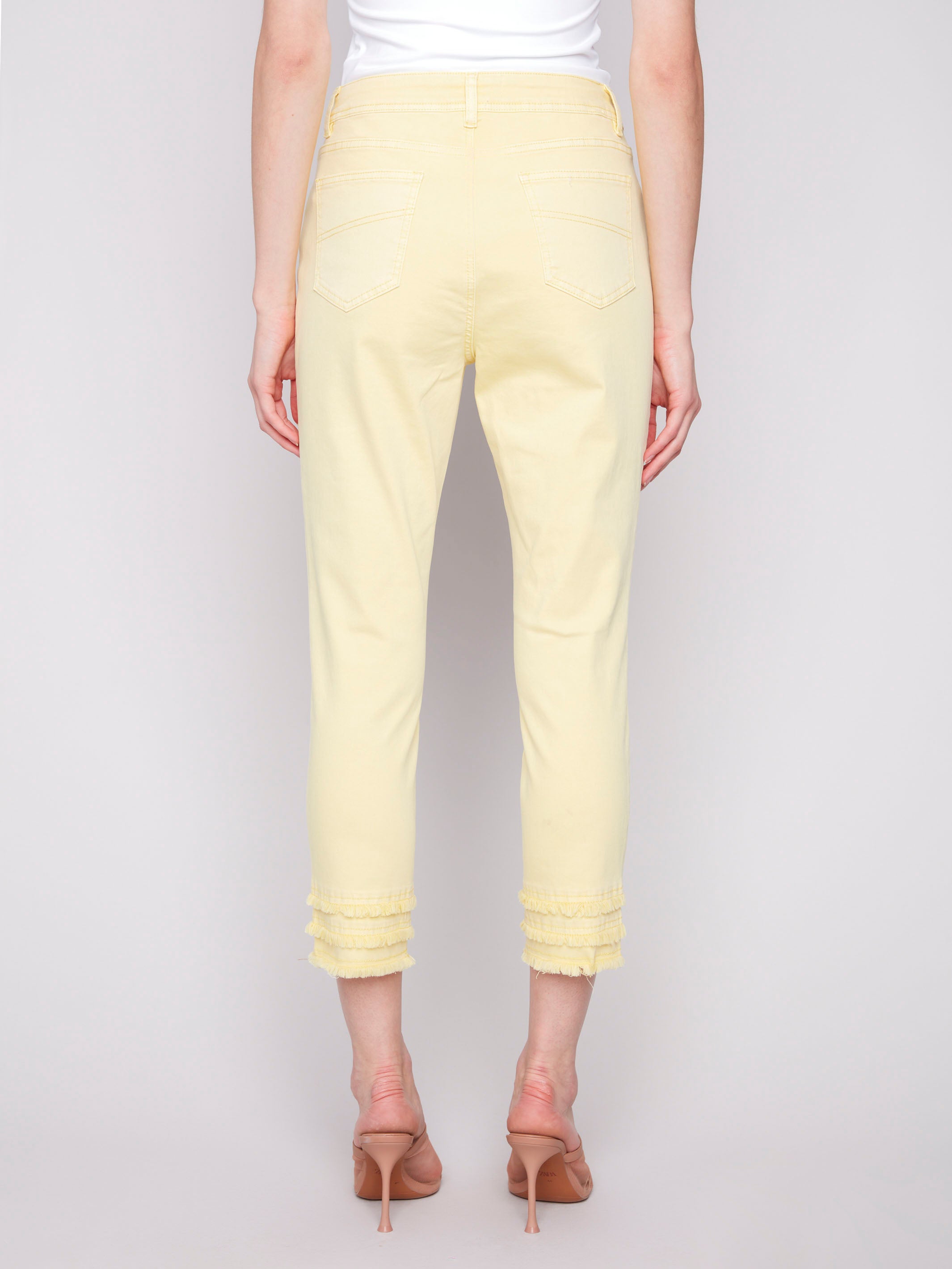 Frayed hem detail on yellow twill pants with a comfortable skinny fit by Charlie B.