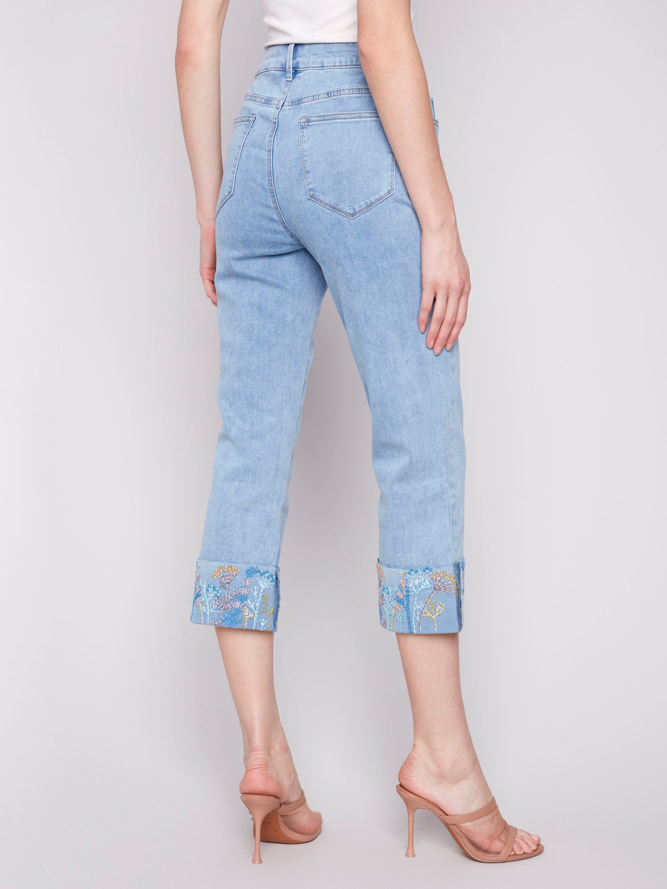 Stylish jeans in light blue with an elegant floral cuff detail by Charlie B.