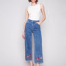 Medium blue jeans with a cropped length and stretch denim by Charlie B.