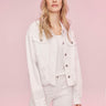 Chic twill jacket in white with two buttoned chest pockets for added style by Charlie B.