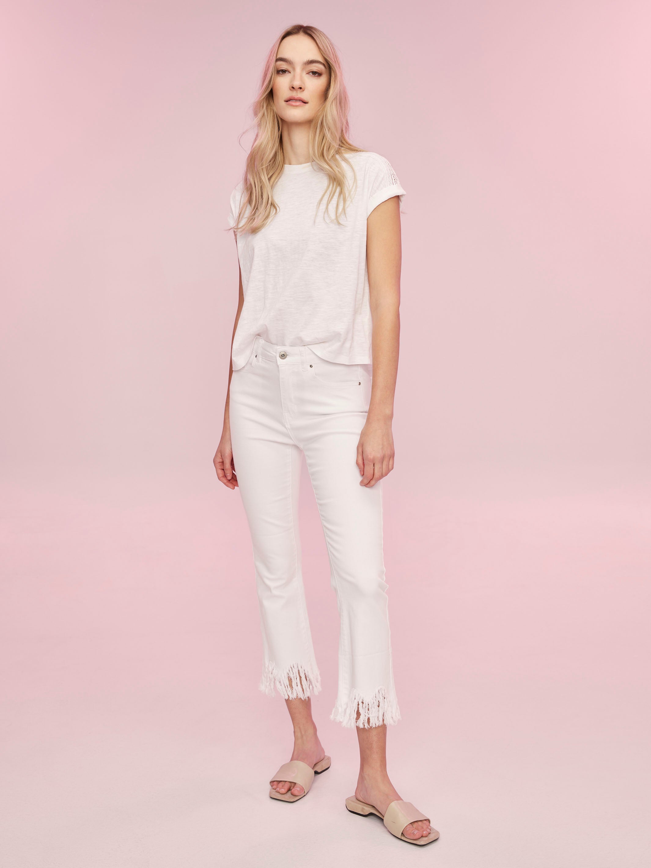 Casual elegance in a white tee with rolled cuffs by Charlie B.