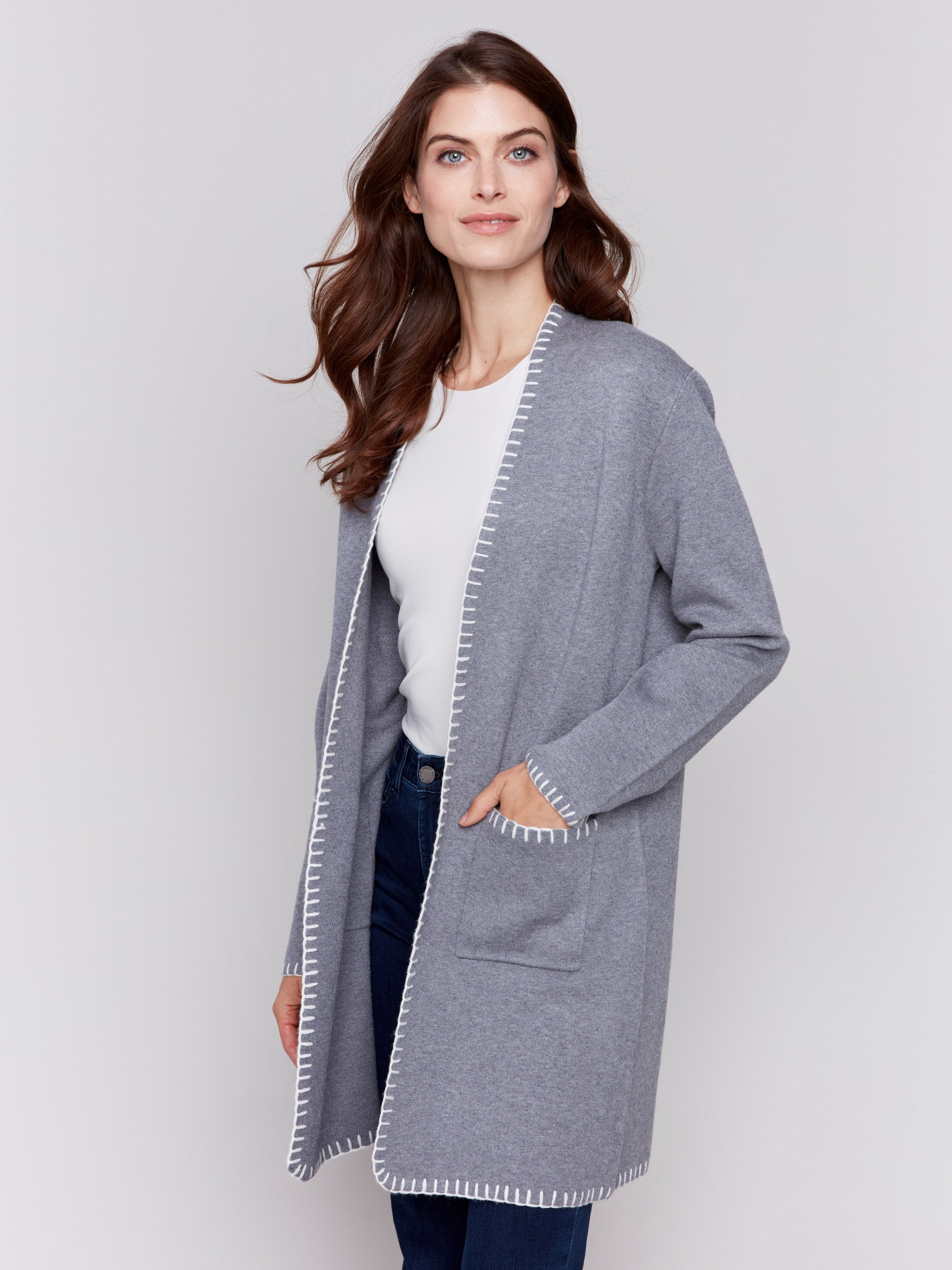 Grey long cardigan with white blanket stitch trim, featuring patch pockets and an open front by Charlie B.