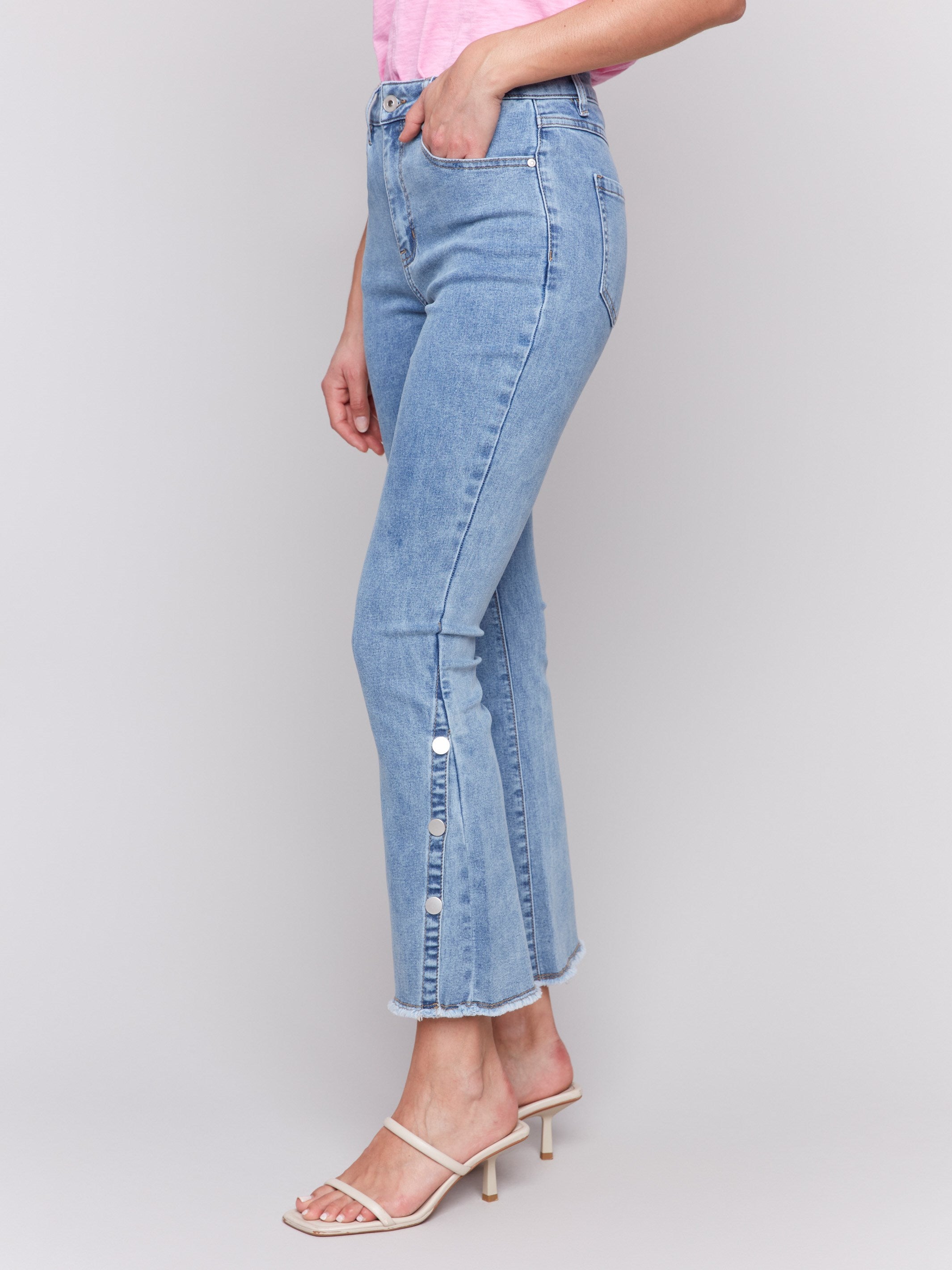 Cropped length light blue jeans featuring a regular rise by Charlie B.