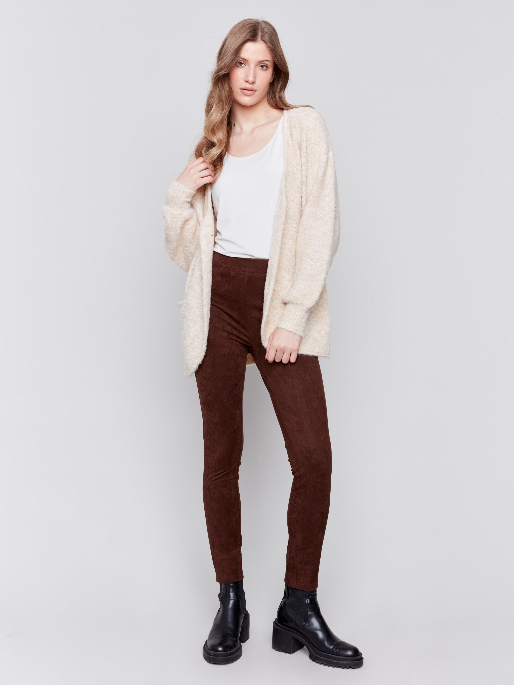 Beige boucle knit cardigan with front button closure and ribbed cuffs by Charlie B.