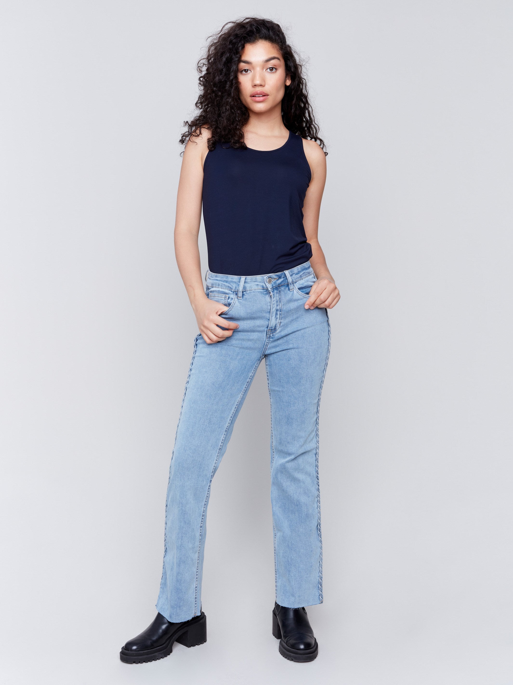 Light blue jeans with braided side seams, regular rise, and straight leg by Charlie B.