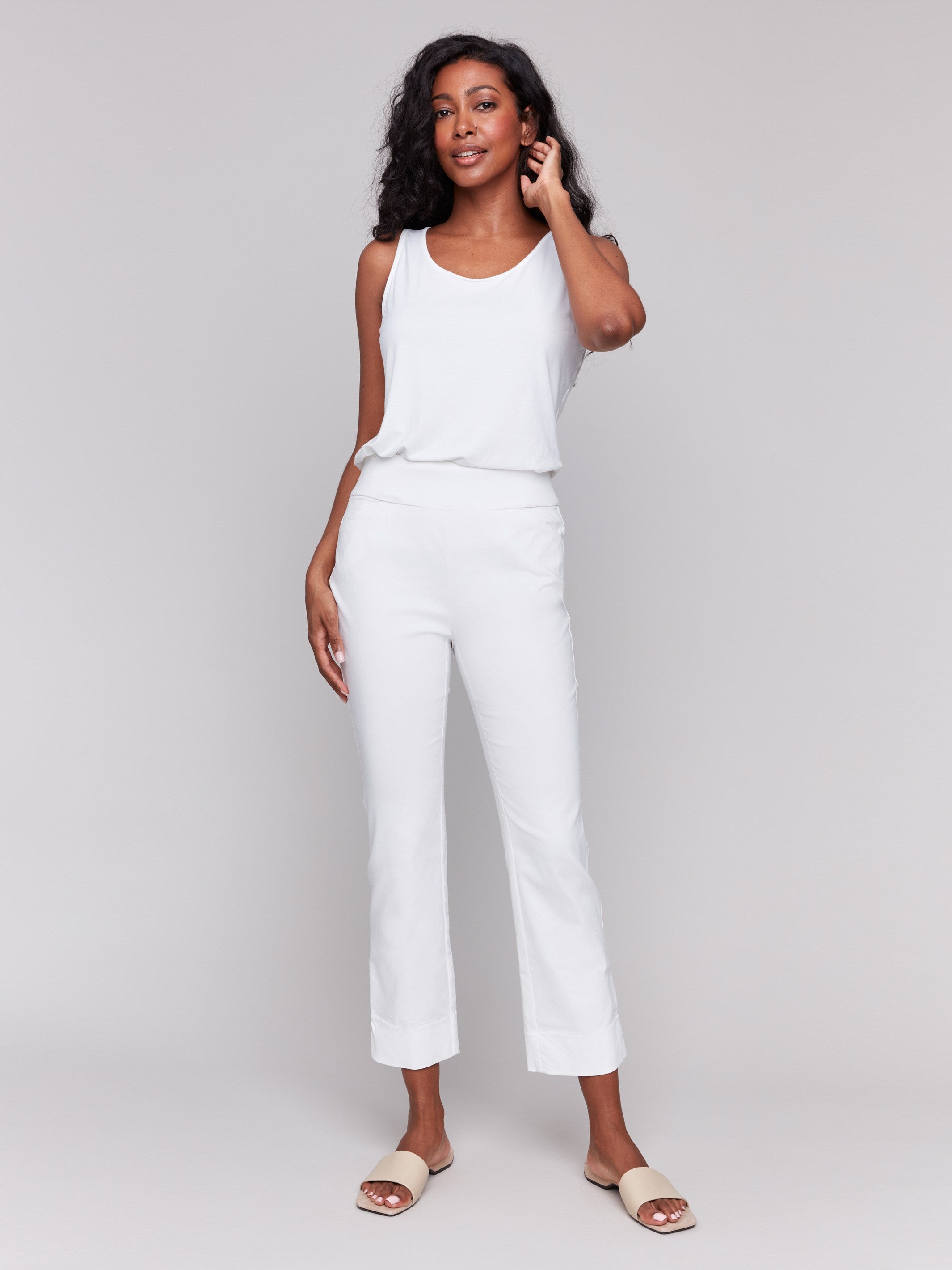 White capri pants with hem slit and side pockets by Charlie B.