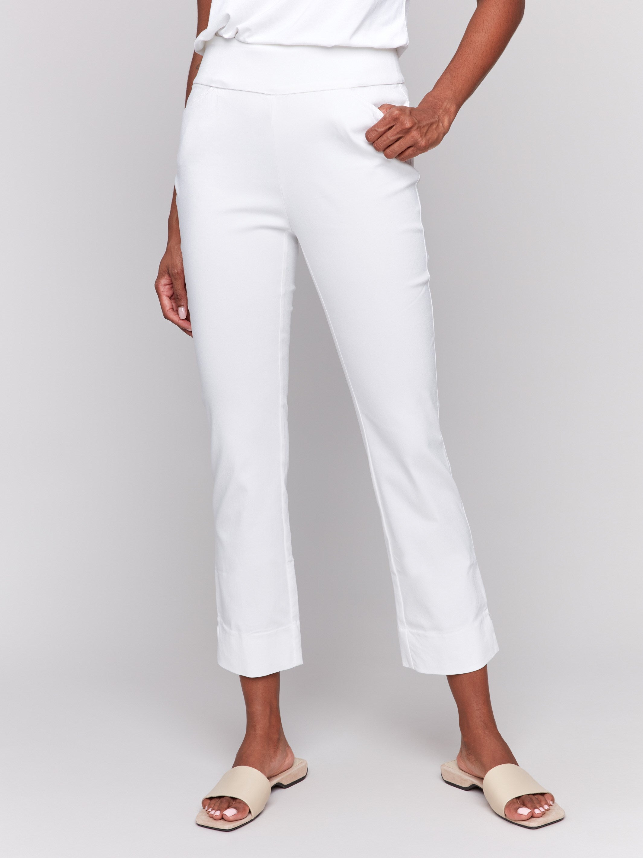 White capri pants with hem slit and side pockets by Charlie B.