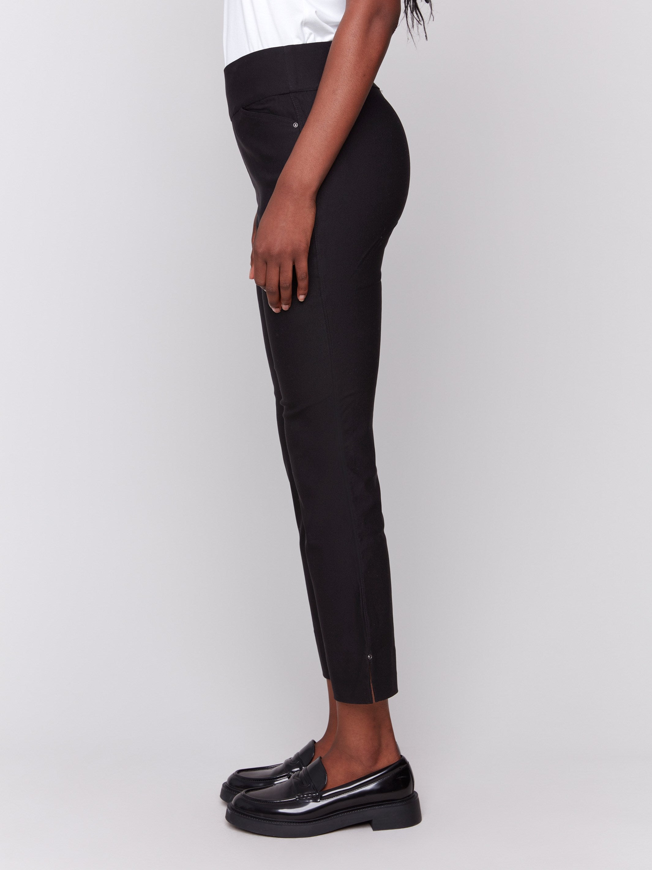 Black capri pants with hem slit and side pockets by Charlie B.