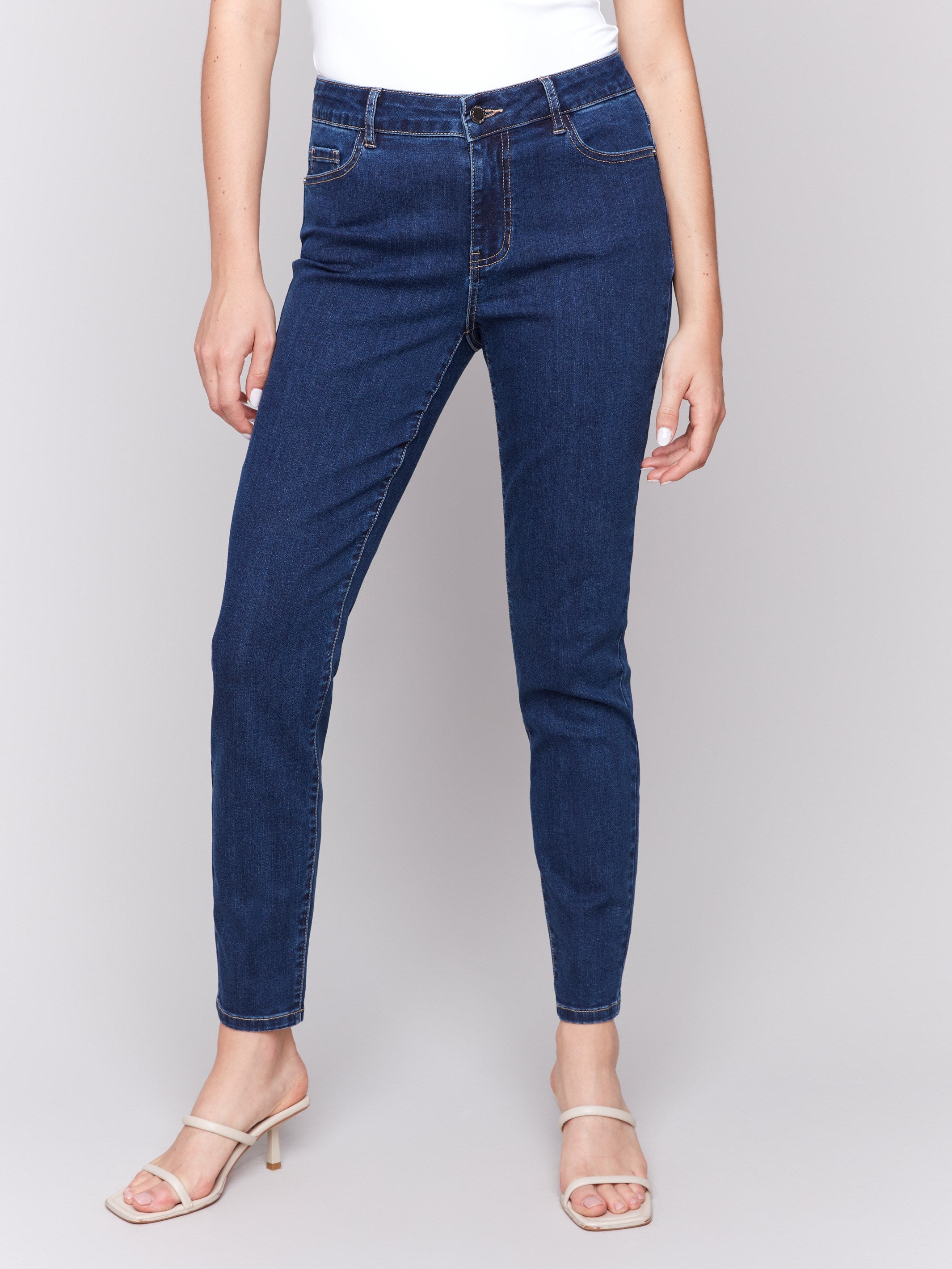 Indigo skinny jeans featuring a five-pocket design by Charlie B, showcasing a sleek and stylish fit.