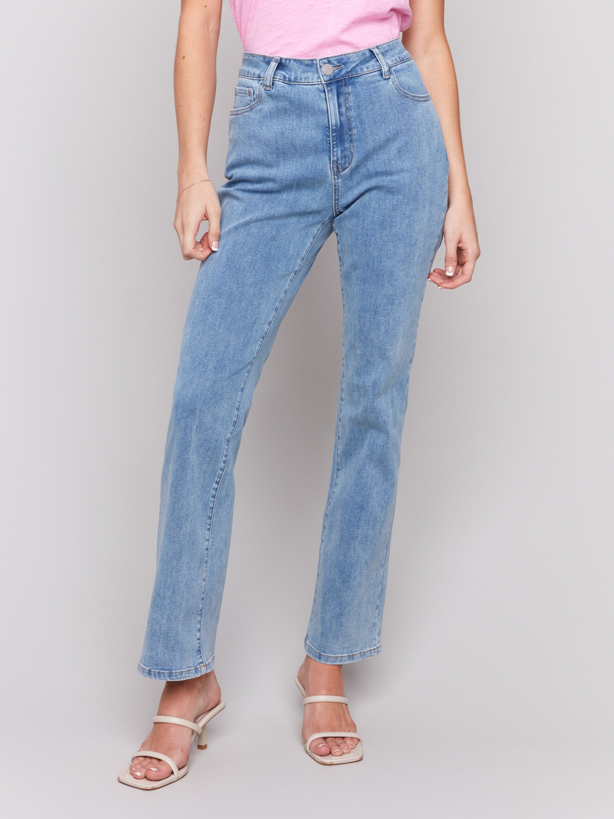 Light blue Celine flare leg jeans with a classic five-pocket design by Charlie B.