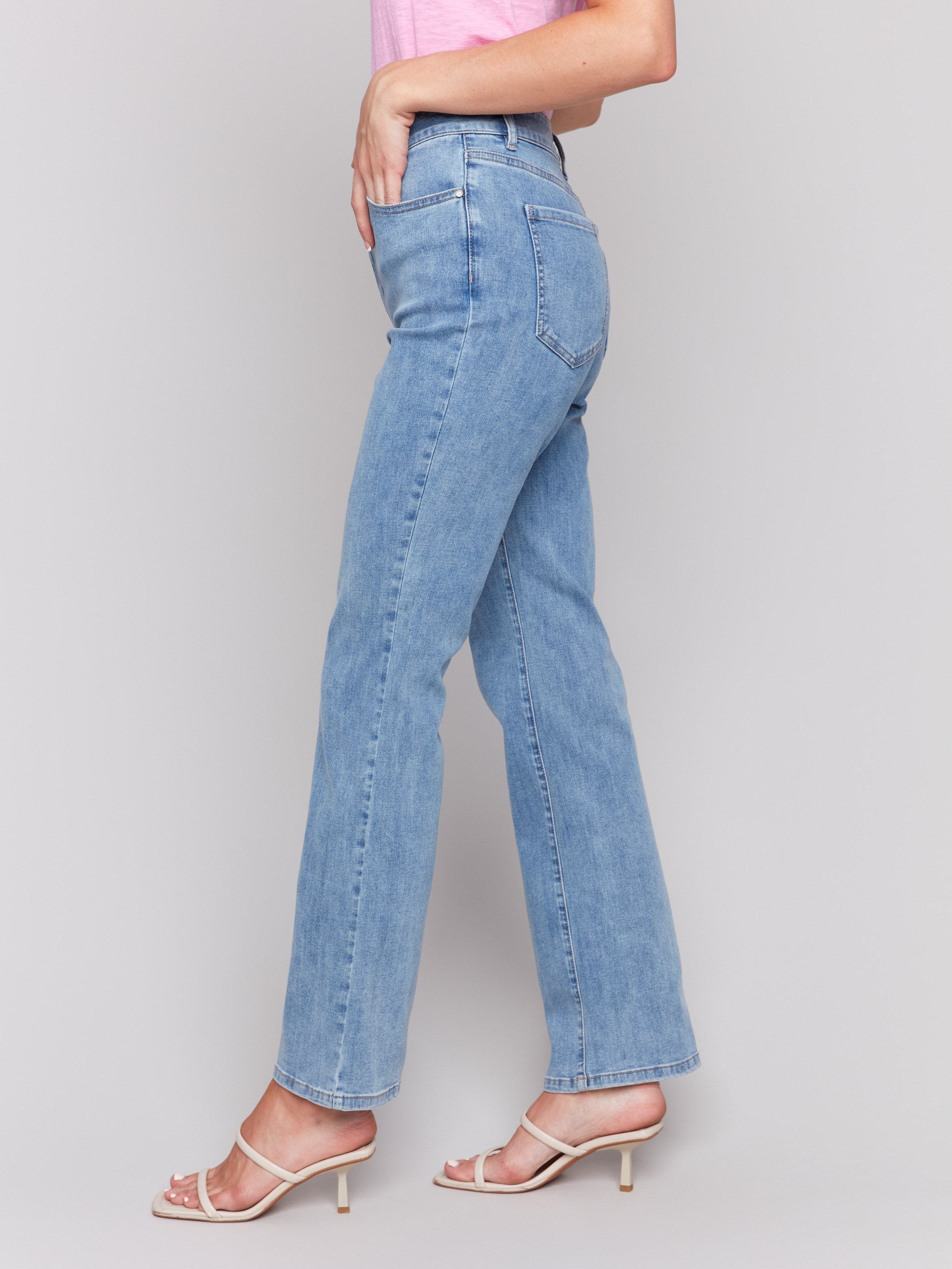 Light blue Celine flare leg jeans with a classic five-pocket design by Charlie B.