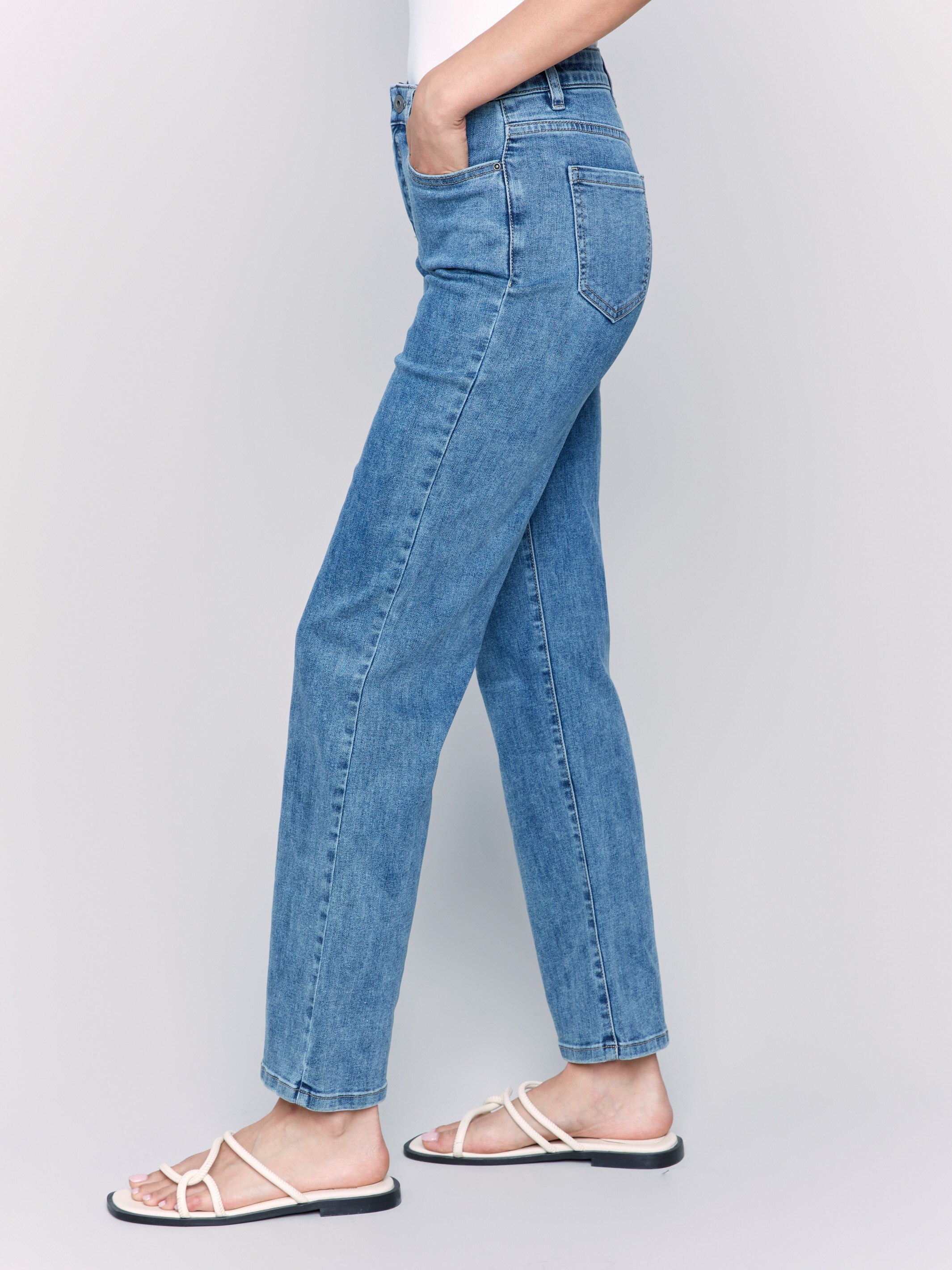 Medium blue straight-leg jeans with classic five-pocket design and elastic waistband by Charlie B.