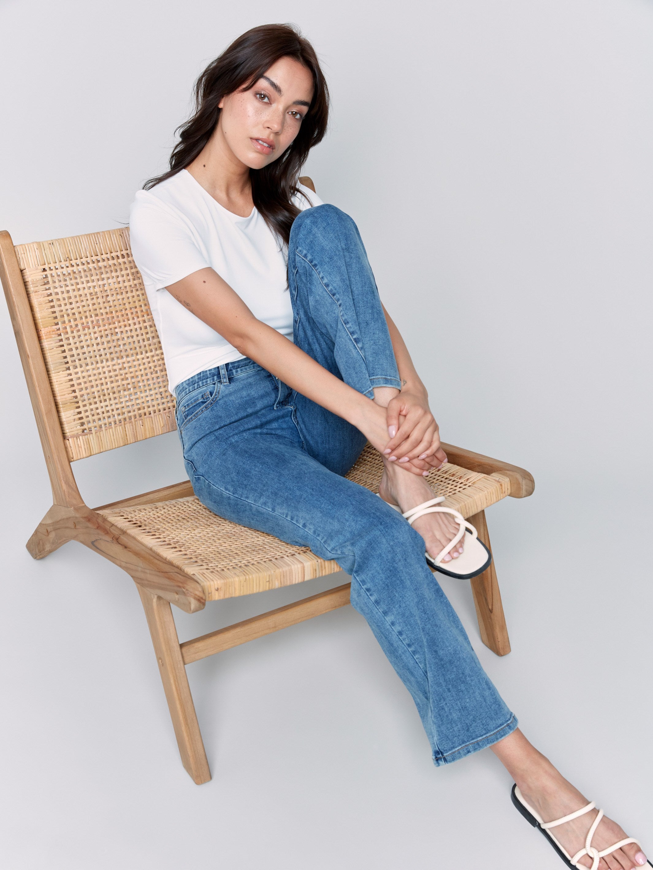 Medium blue straight-leg jeans with classic five-pocket design and elastic waistband by Charlie B.