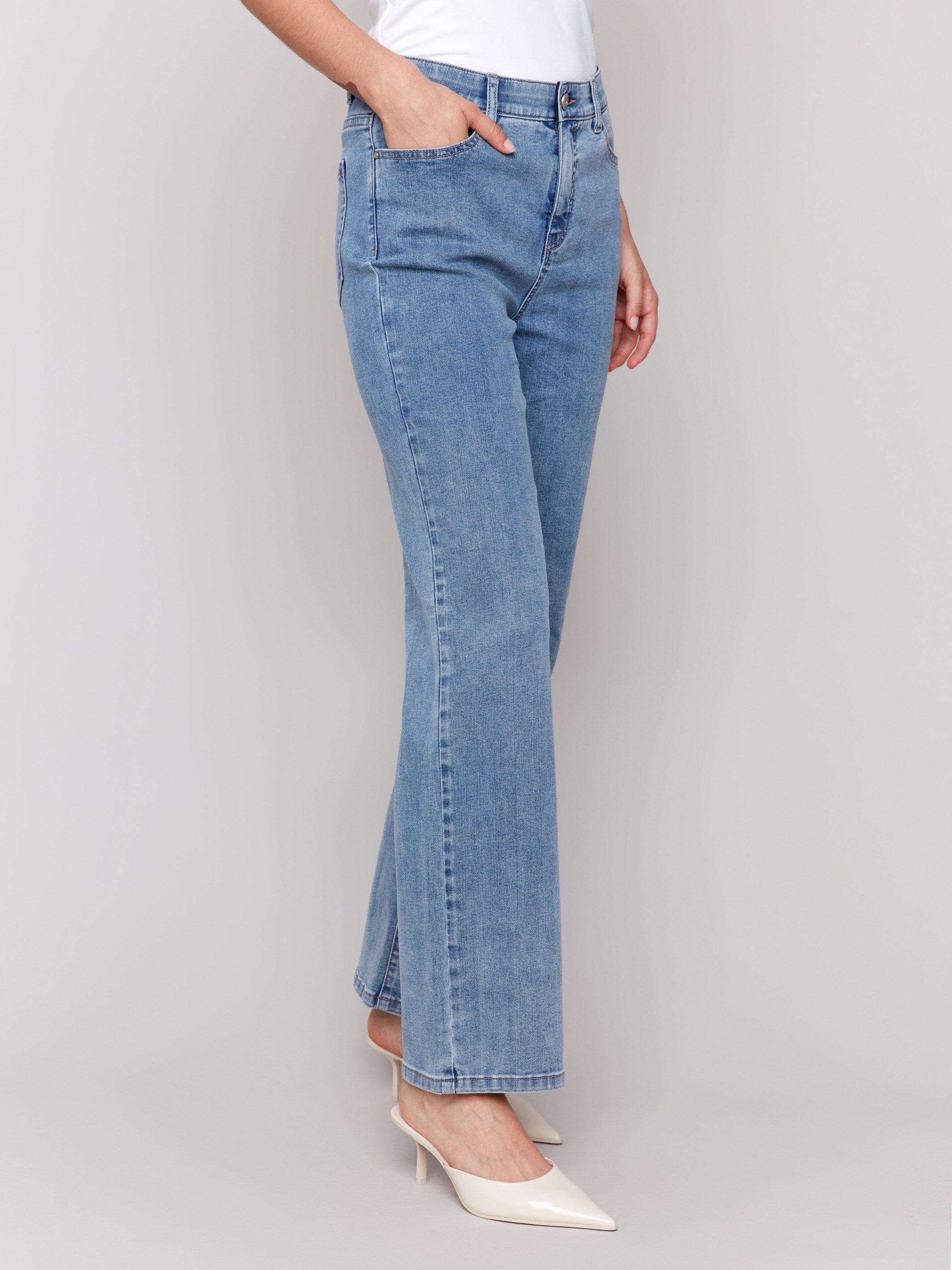 Light blue straight-leg jeans with classic five-pocket design and elastic waistband by Charlie B.