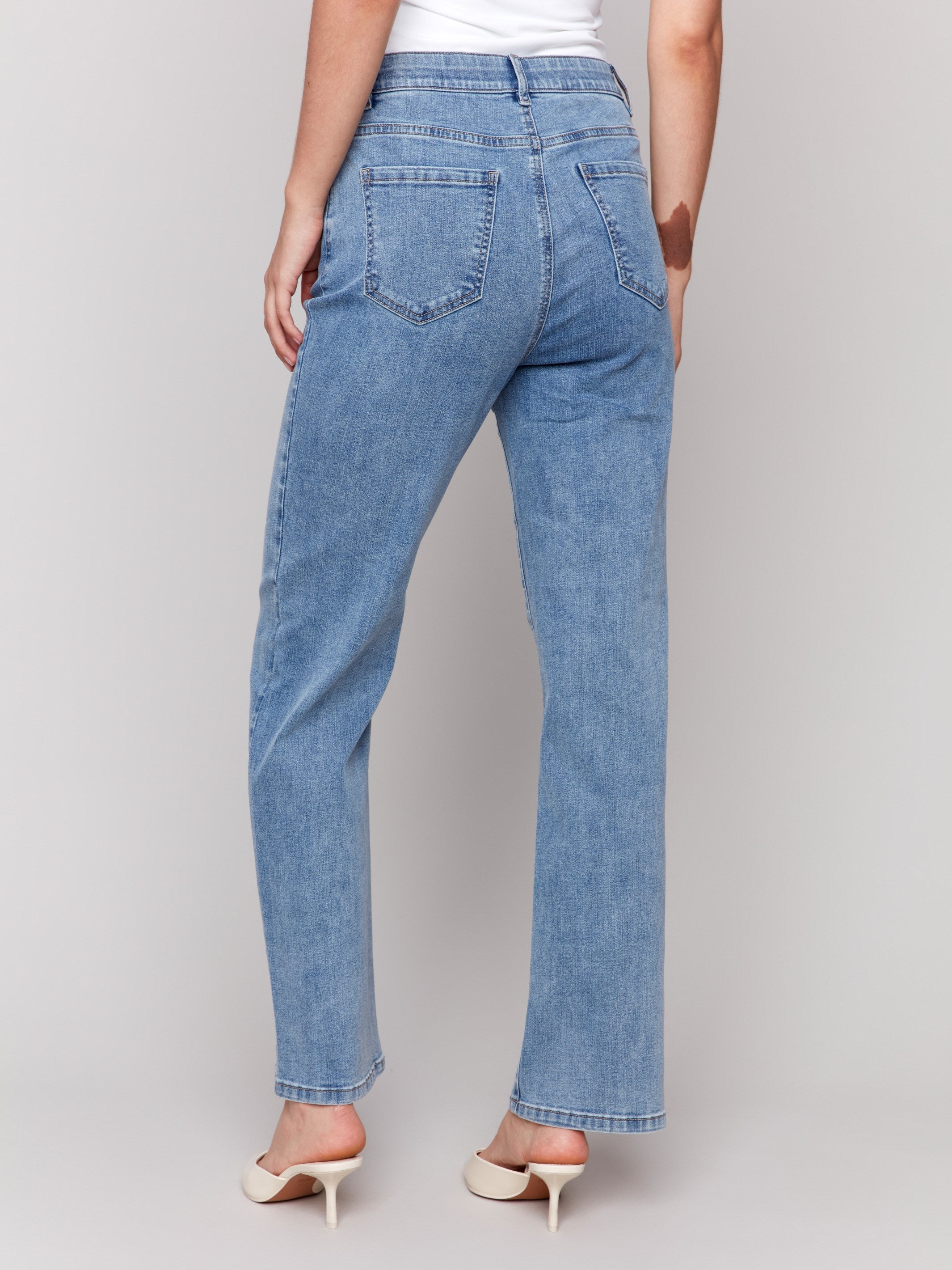 Light blue straight-leg jeans with classic five-pocket design and elastic waistband by Charlie B.