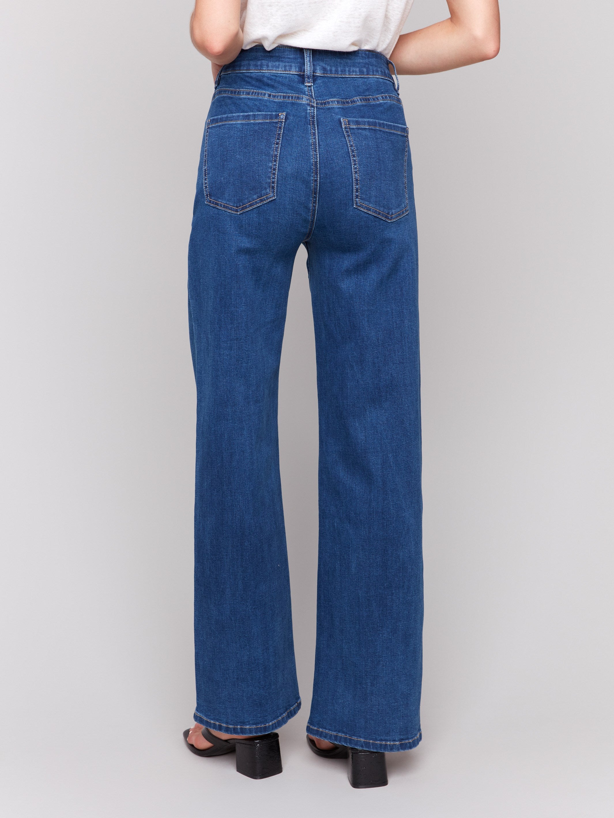 Indigo wide-leg jeans with five-pocket design featuring a button closure and relaxed fit by Charlie B.