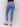 Medium blue slim leg jeans with five-pocket design and button closure by Charlie B.