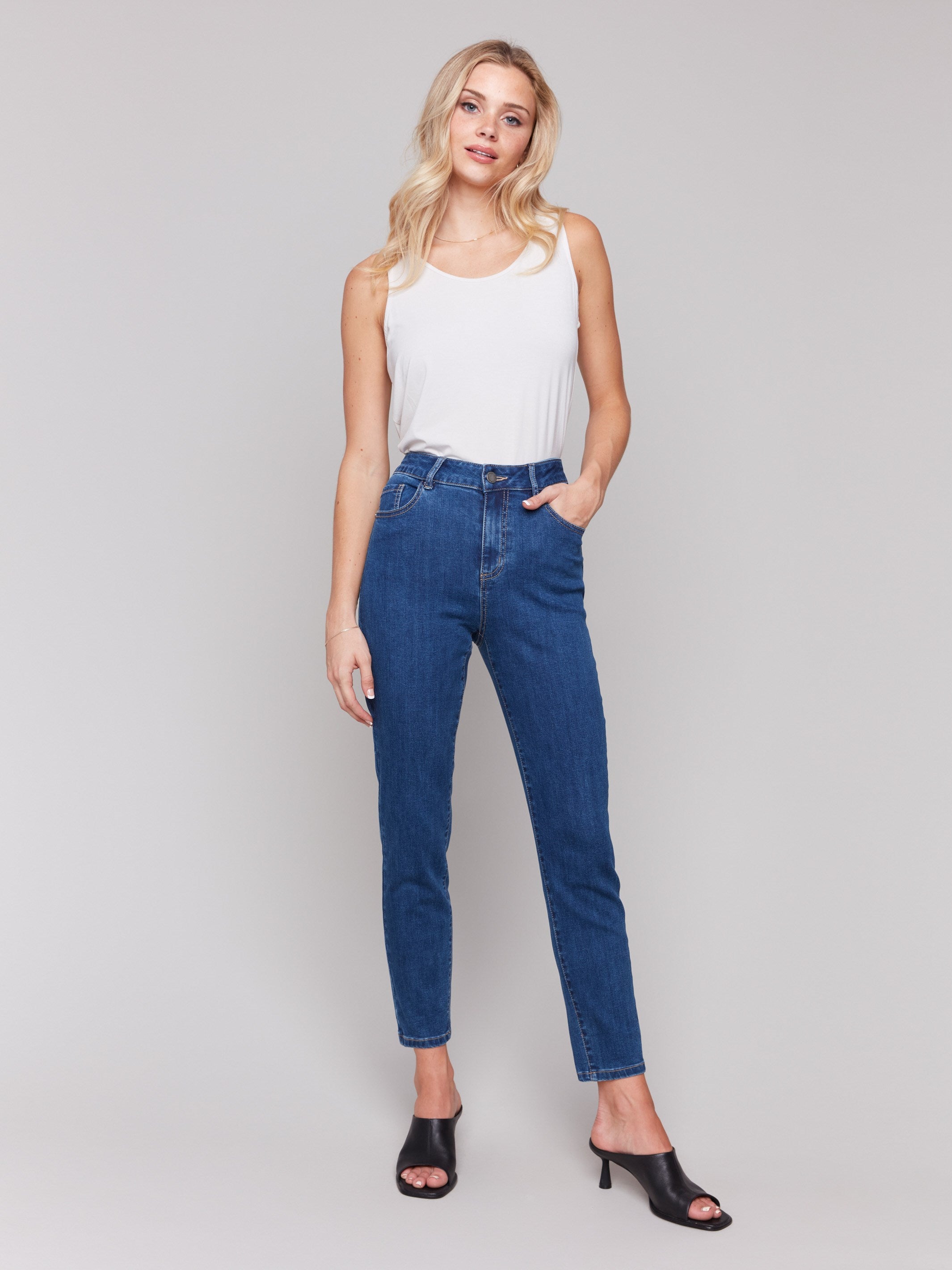 Indigo slim leg jeans with five-pocket design and button closure by Charlie B.