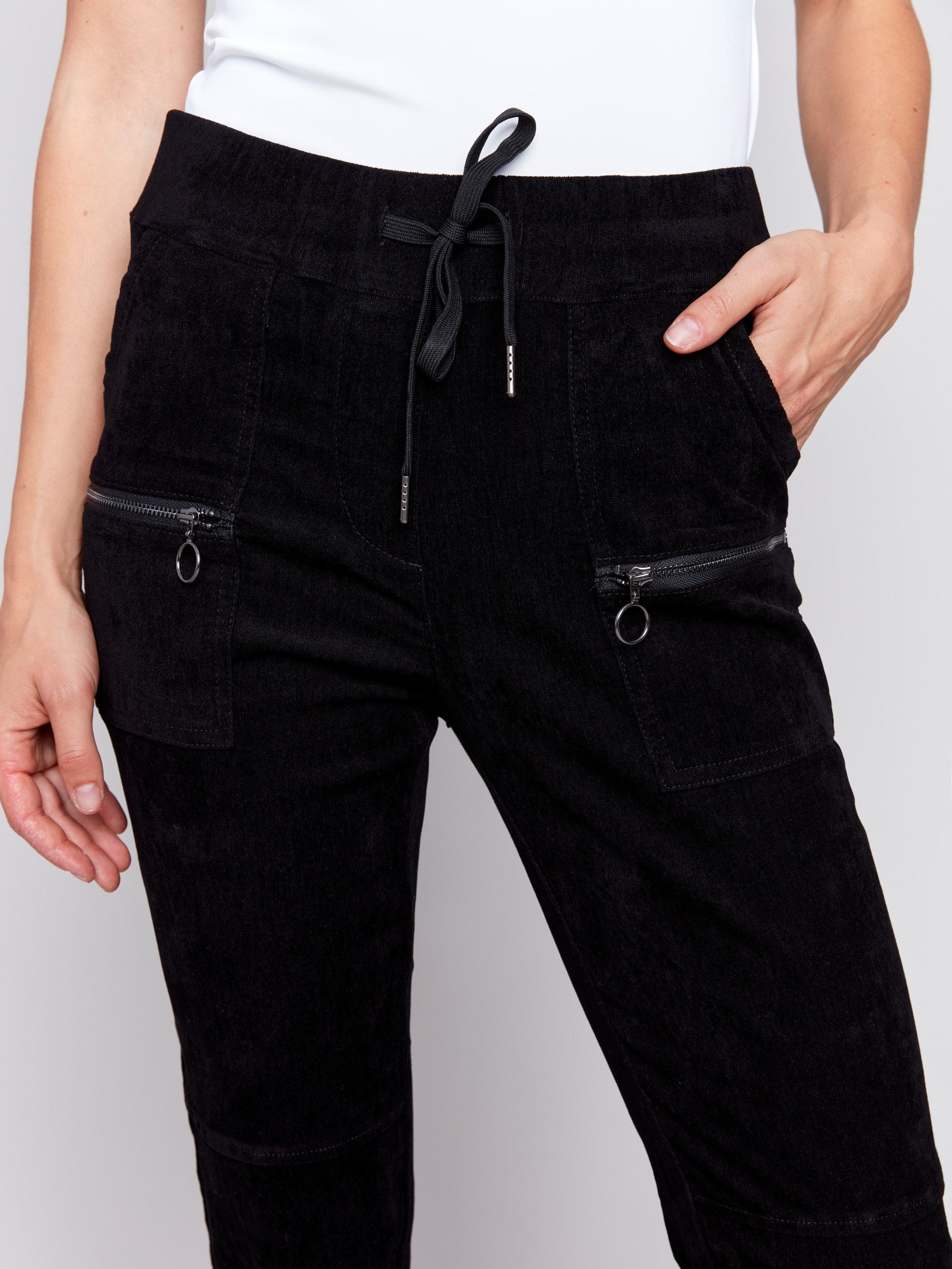 Black corduroy jogger pants with an elastic waistband, drawstrings, and slim fit by Charlie B.