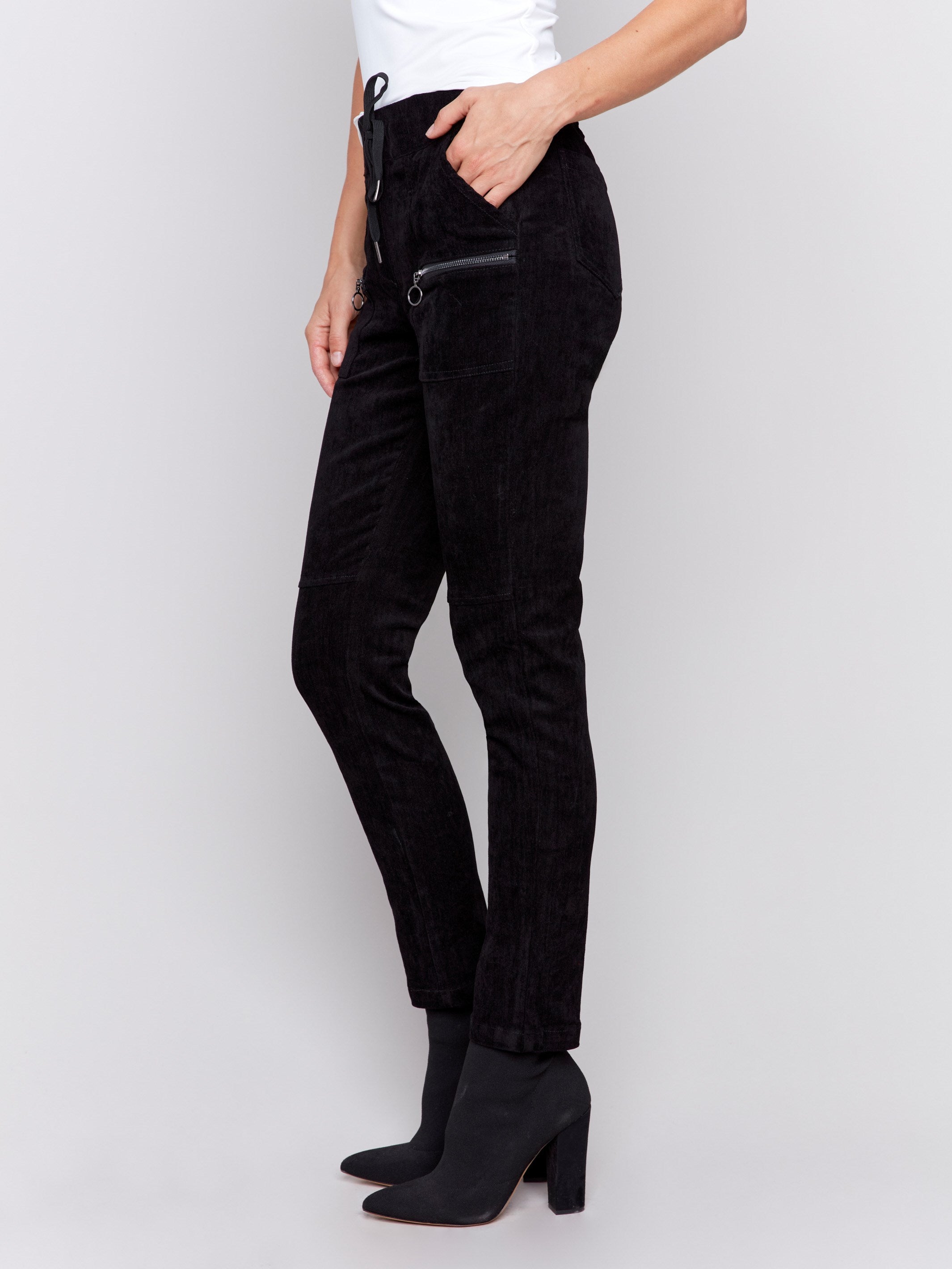 Black corduroy jogger pants with an elastic waistband, drawstrings, and slim fit by Charlie B.