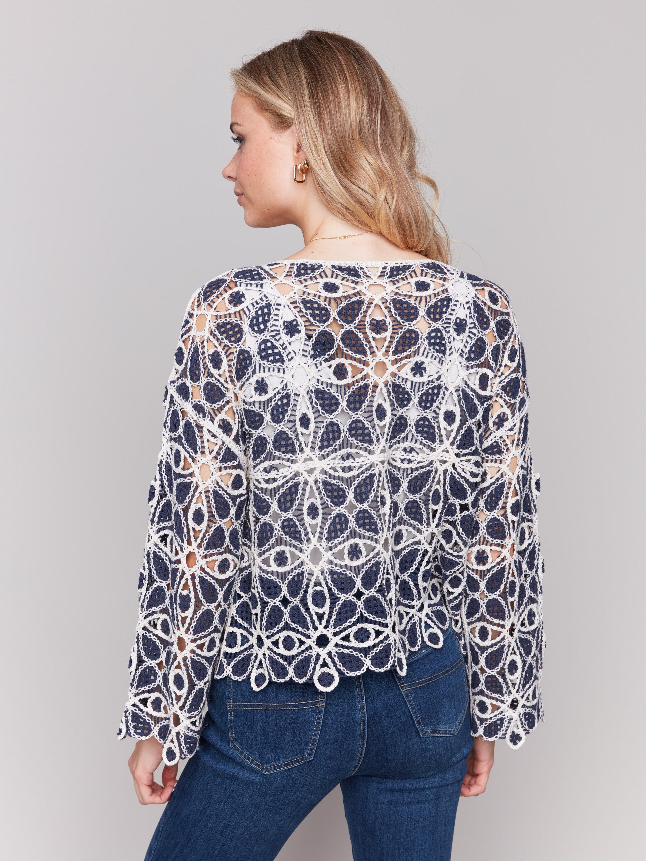 Stylish 3/4 sleeve detail on the blue and white crochet top by Charlie B.