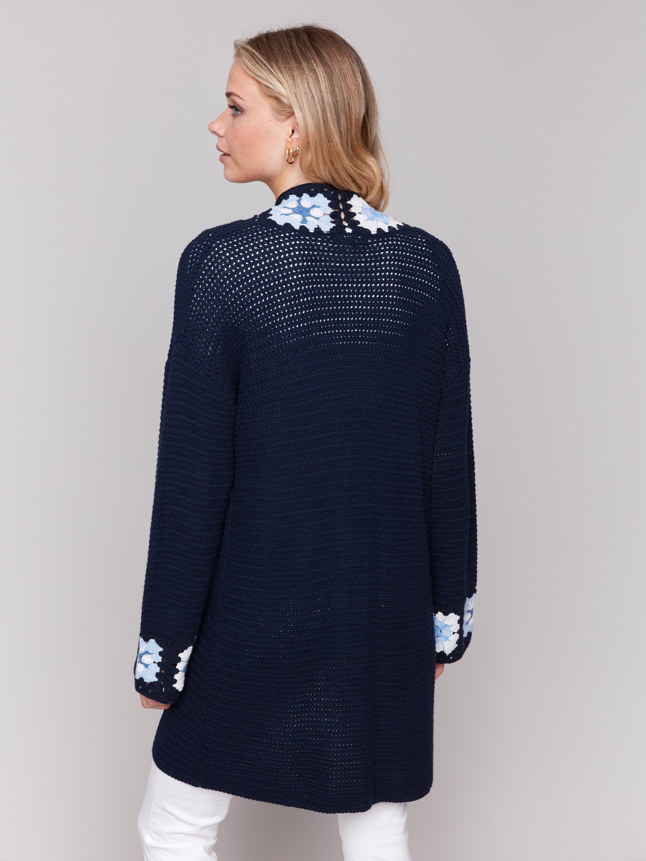 Elegant navy cardigan showcasing intricate crochet patterns by Charlie B.