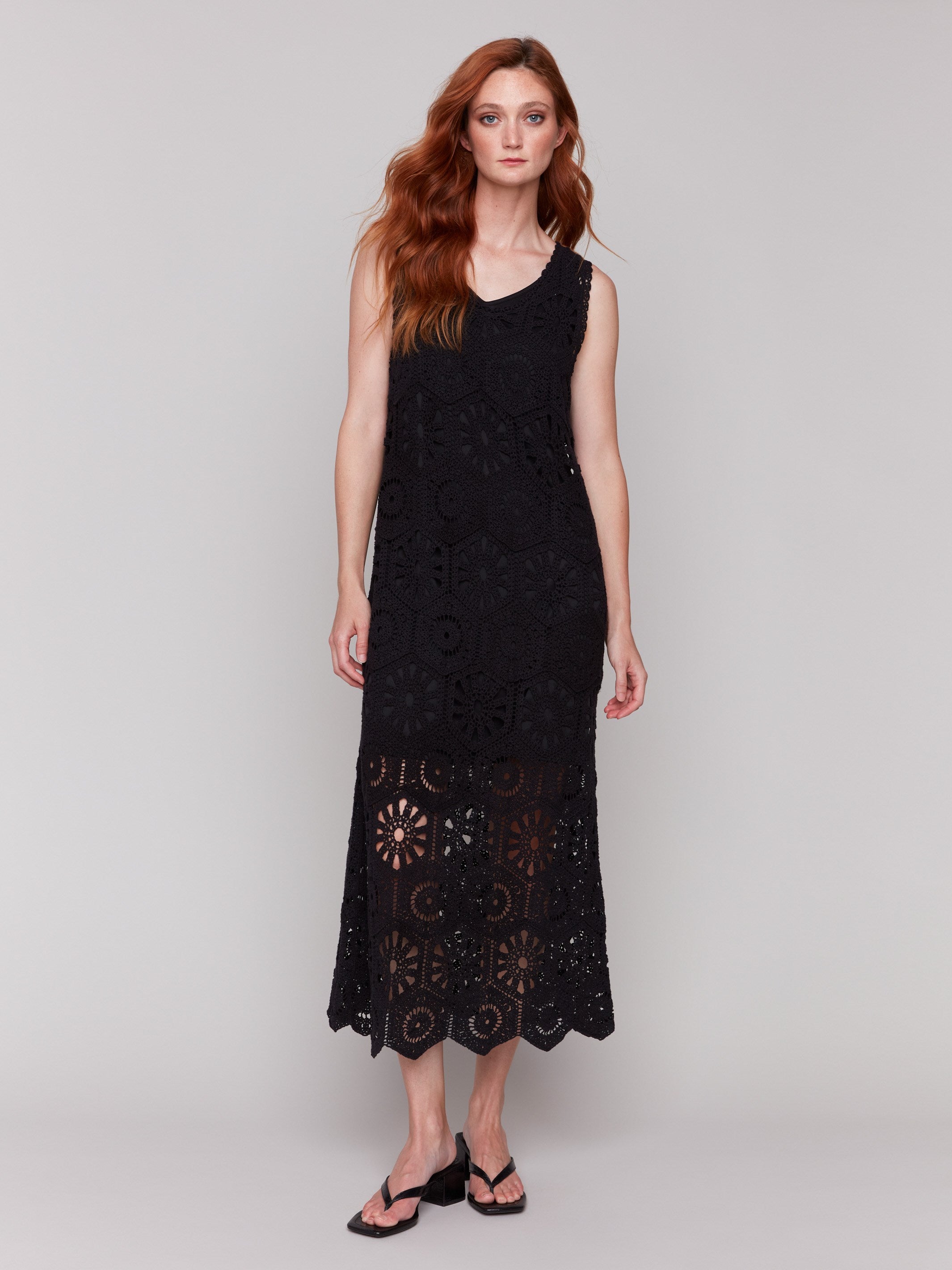 Black crochet maxi dress with handcrafted patterns by Charlie B.