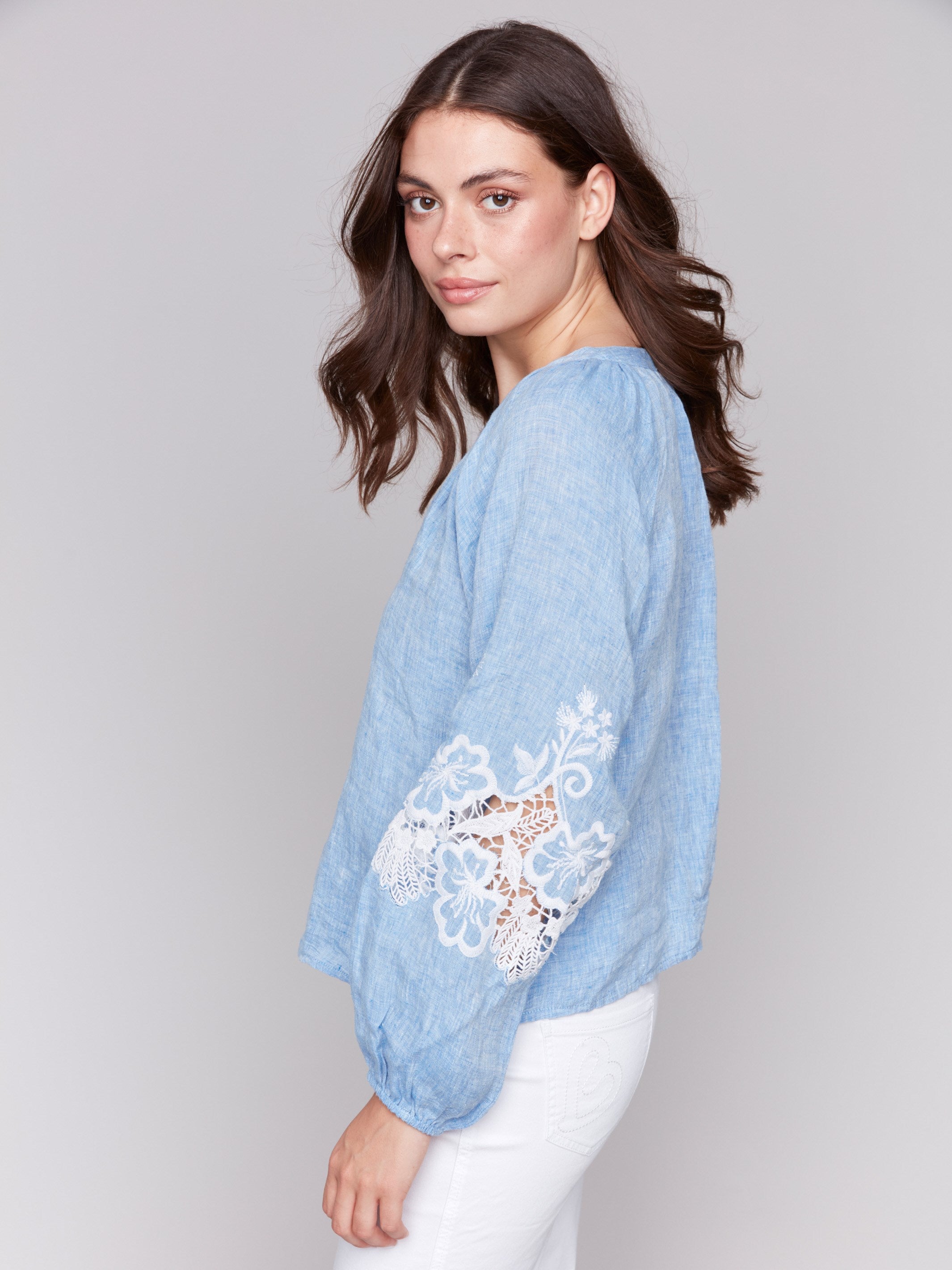 Chambray top adorned with artisan embroidery on sleeves by Charlie B.