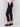 Black cropped crepe pants with side pockets and a slim leg design by Charlie B.