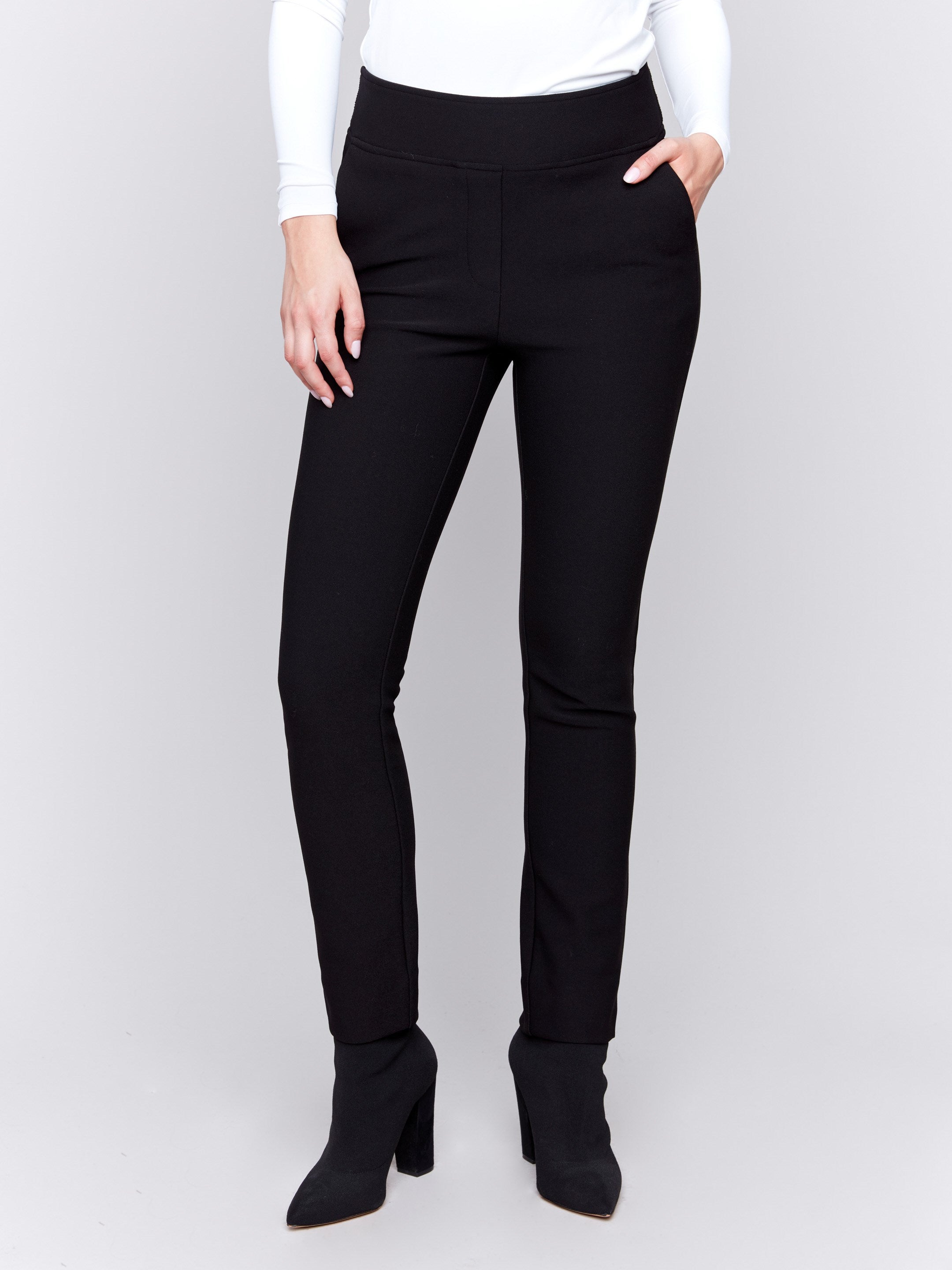 Black slim fit crepe dress pants with side and back pockets, featuring a clean and elegant design by Charlie B.