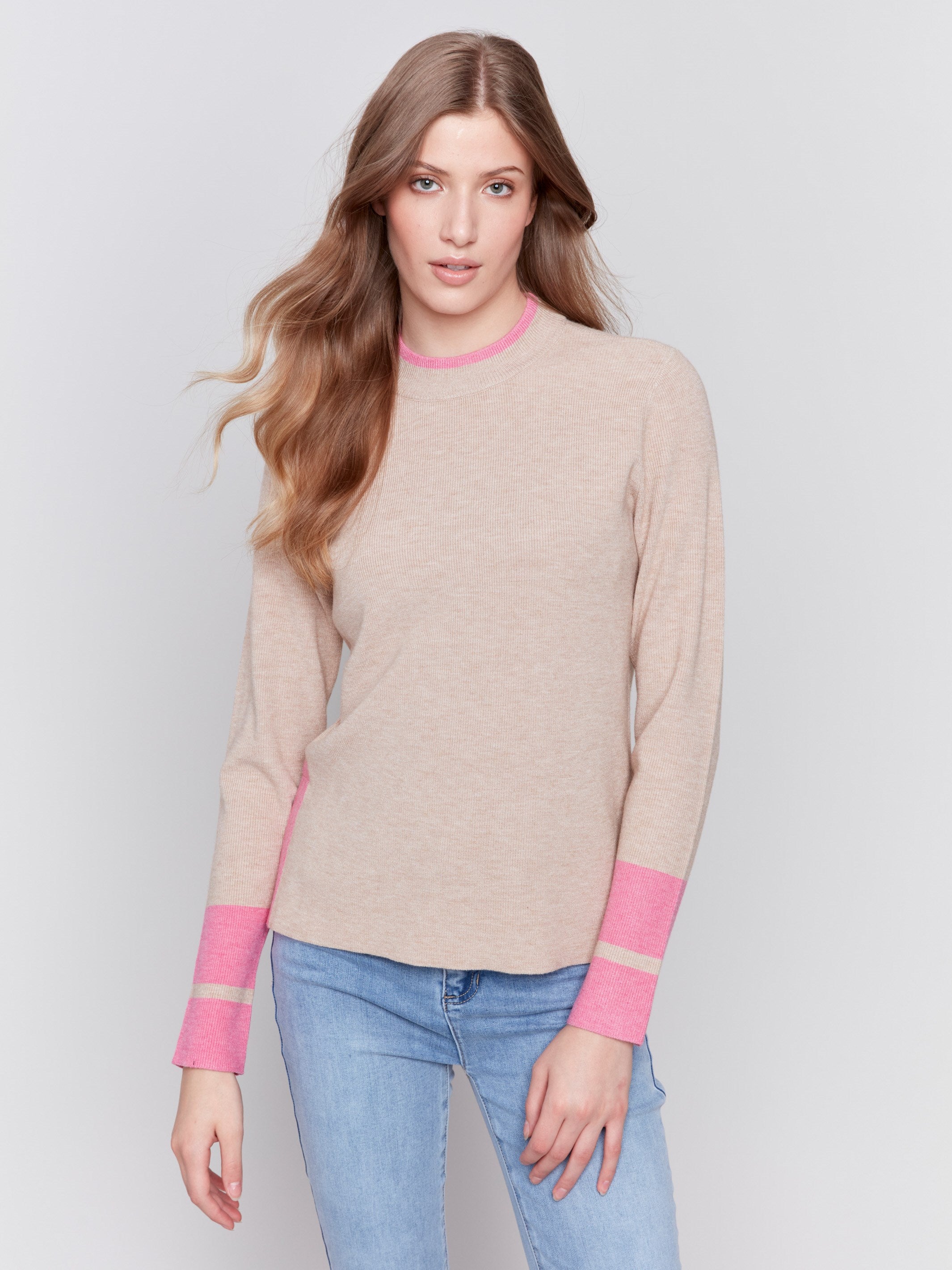 Beige crew neck sweater with pink accents and side slit, long sleeves, ideal for a casual look by Charlie B.