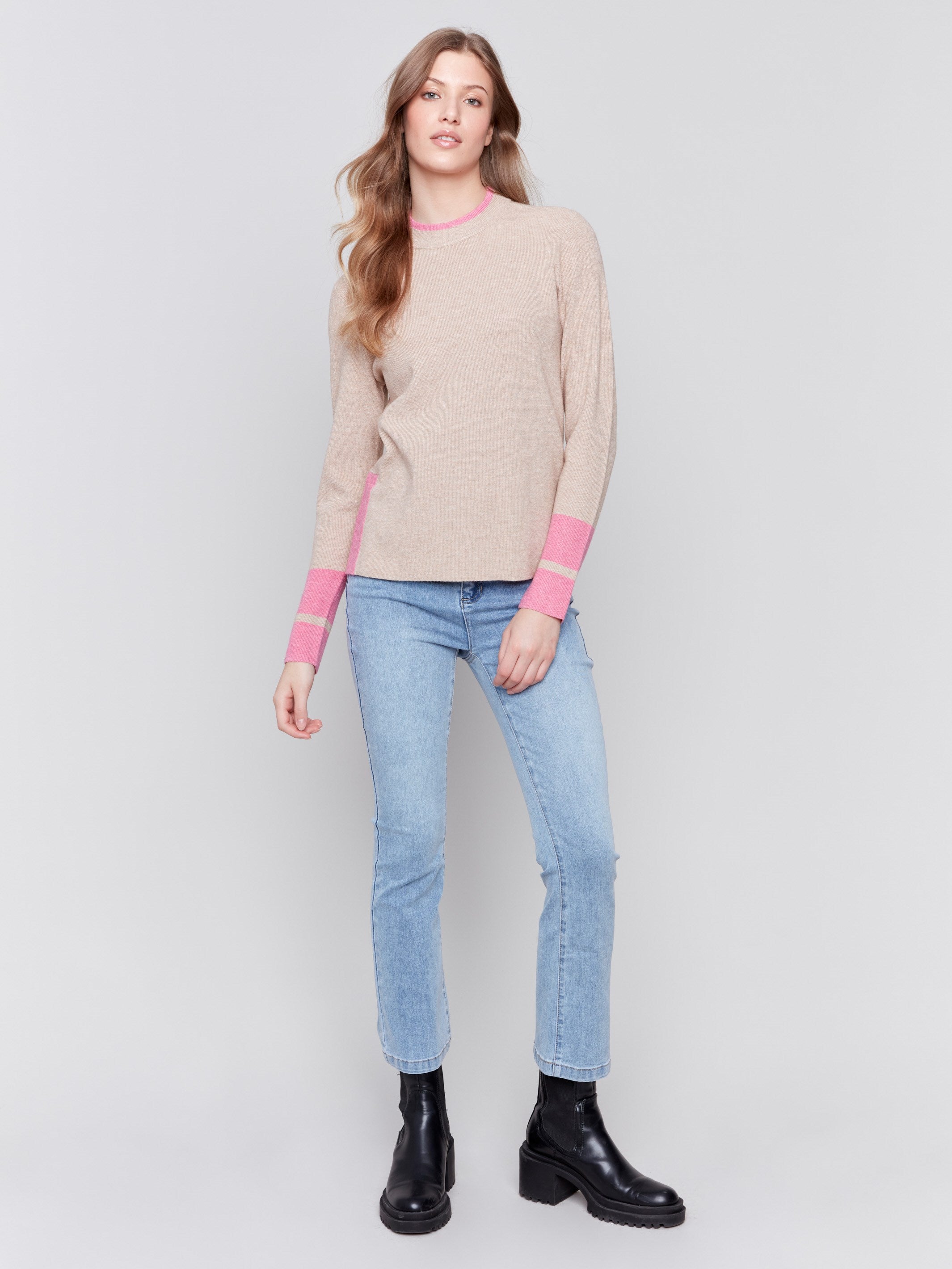 Beige crew neck sweater with pink accents and side slit, long sleeves, ideal for a casual look by Charlie B.