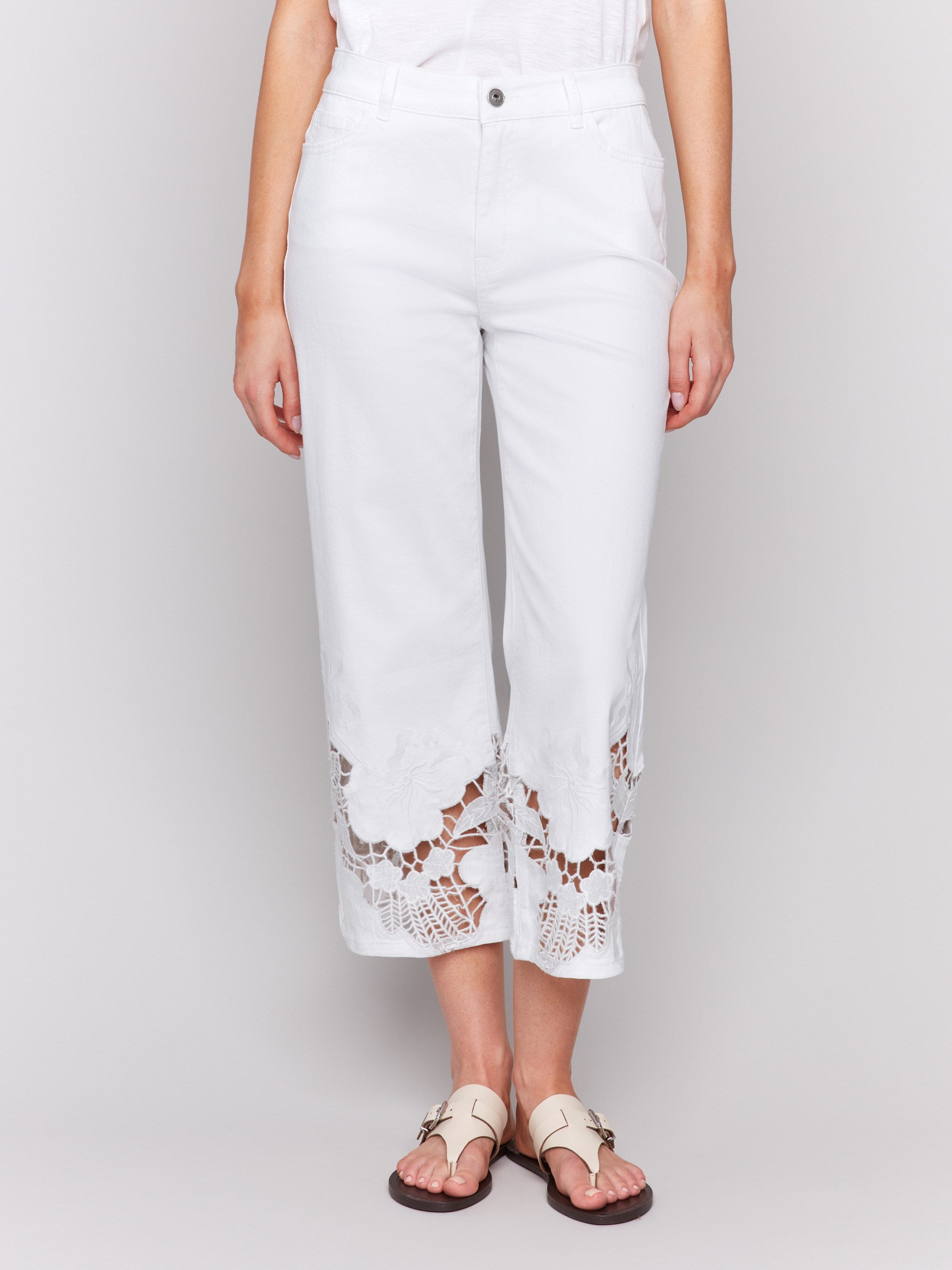 Cropped white jeans featuring stretch denim material by Charlie B.