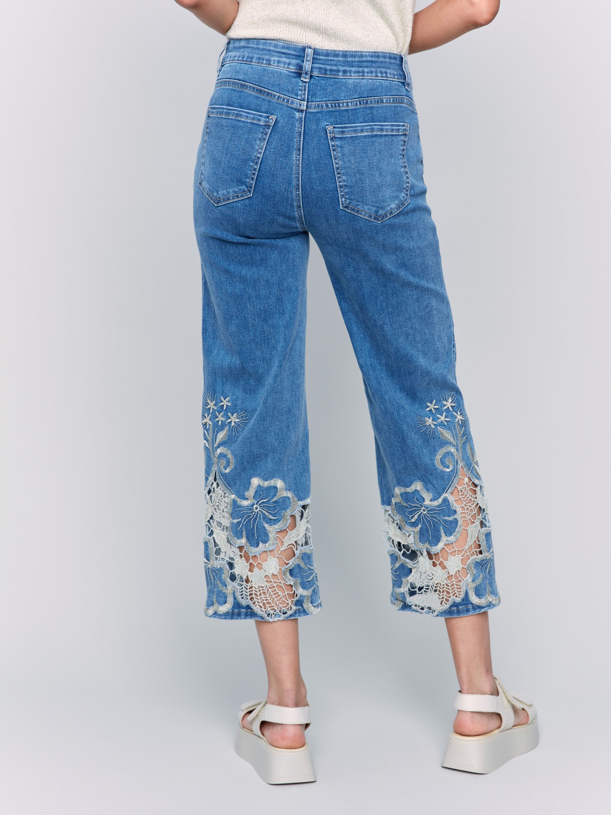 Stylish flare leg jeans crafted from stretch denim material in medium blue by Charlie B.