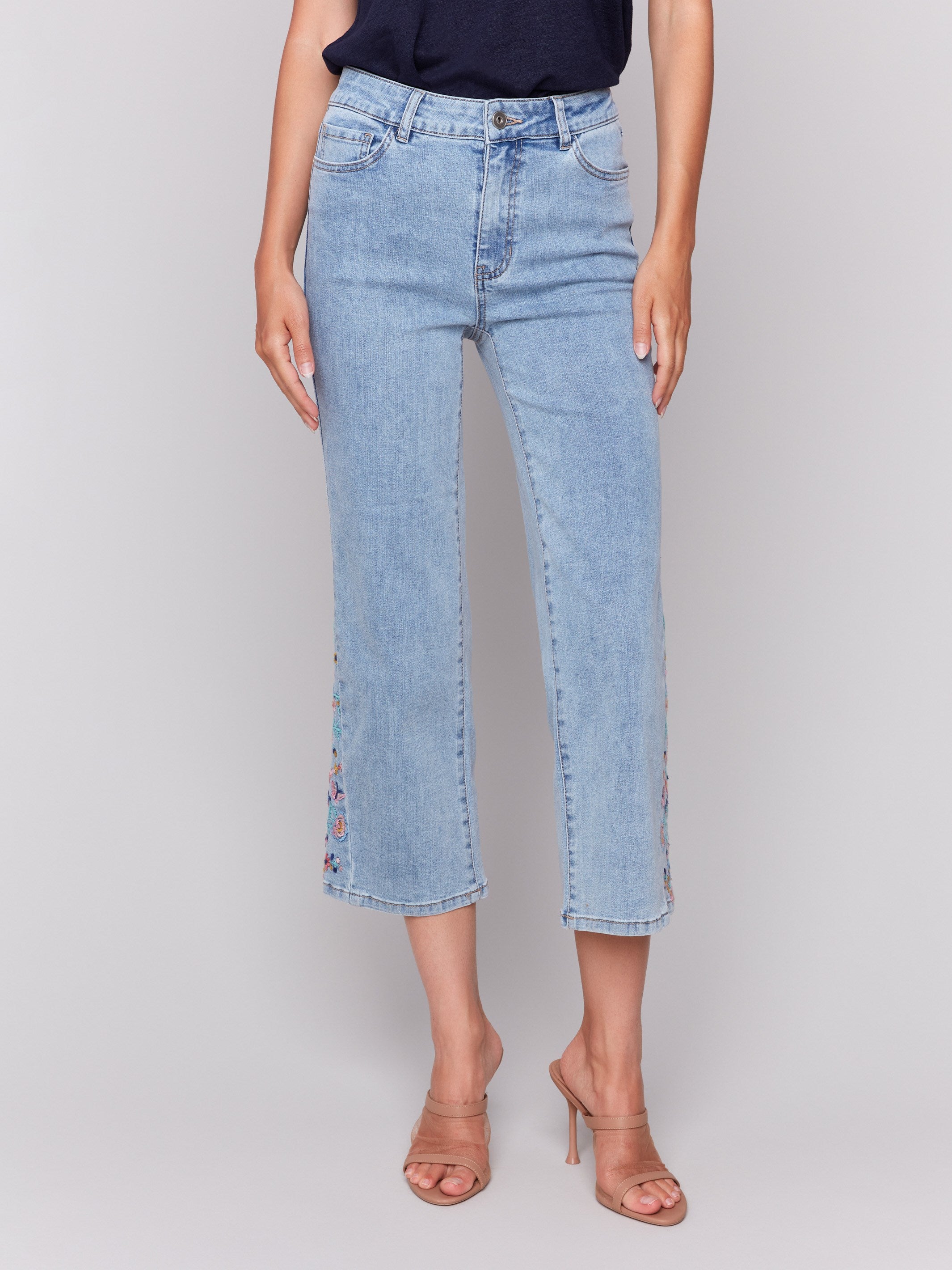 Cropped length jeans featuring floral embroidery on the sides by Charlie B.