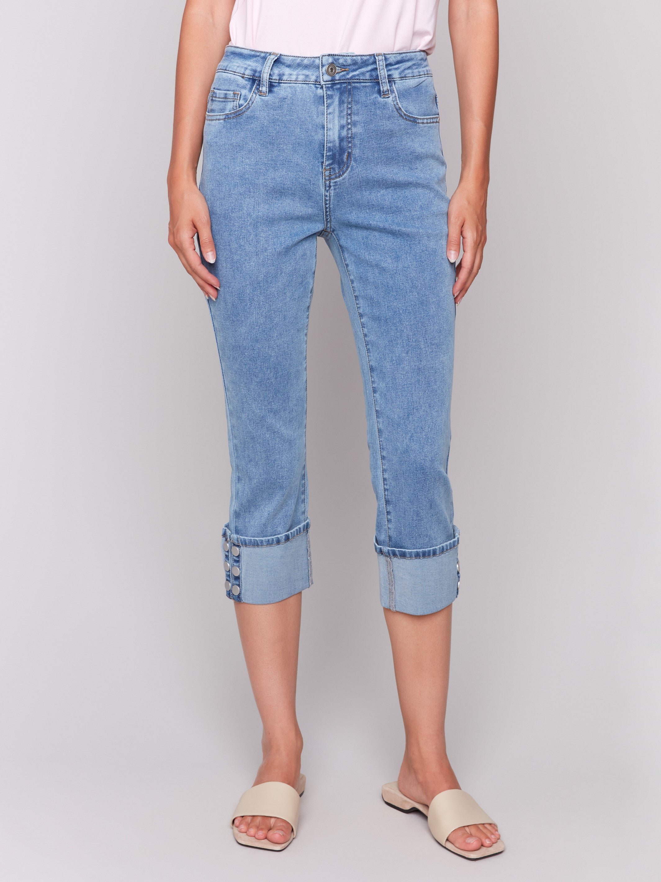 Cropped length jeans featuring a five-pocket design by Charlie B.