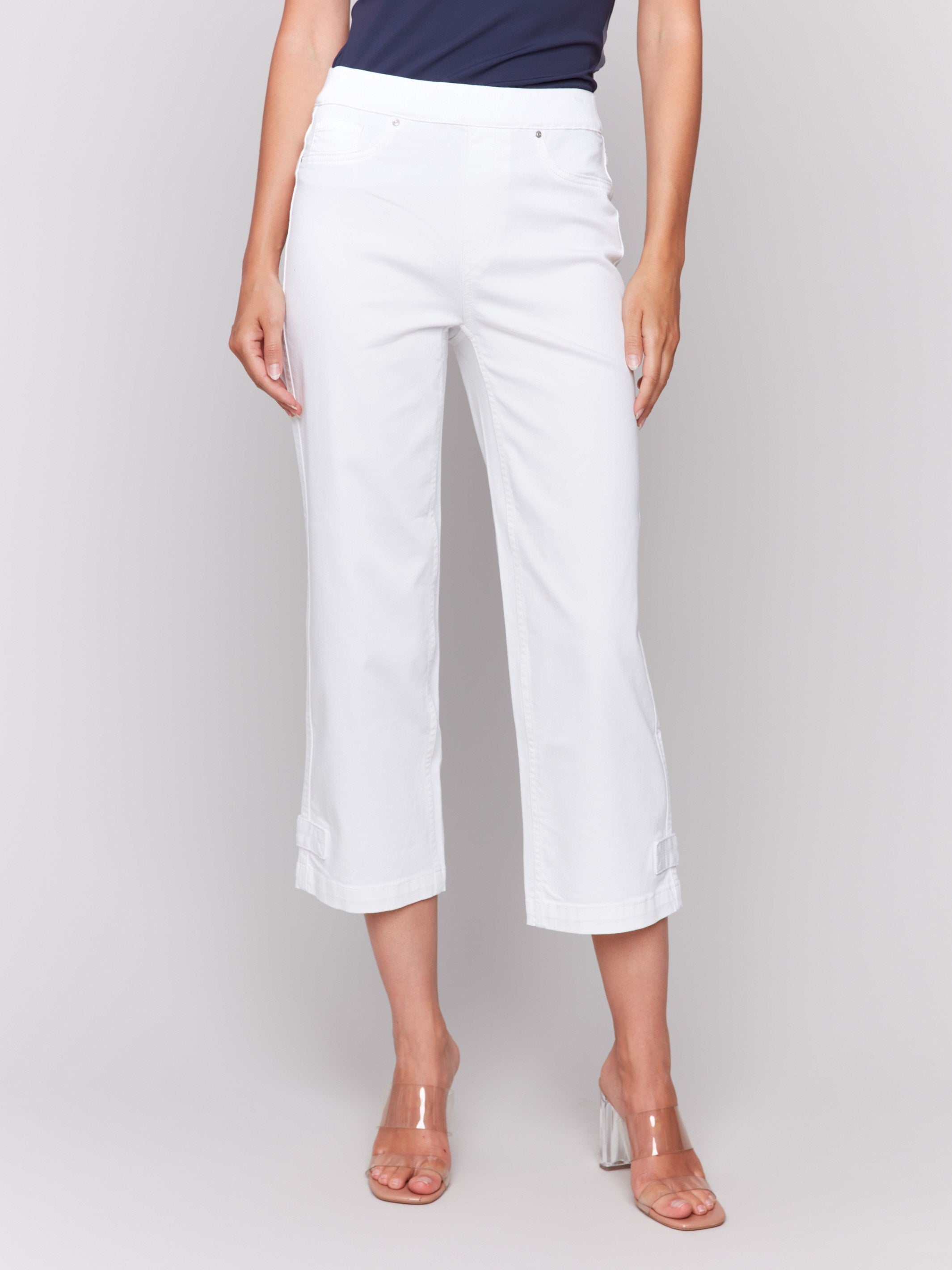 Cropped length white pants with faux front pockets by Charlie B.